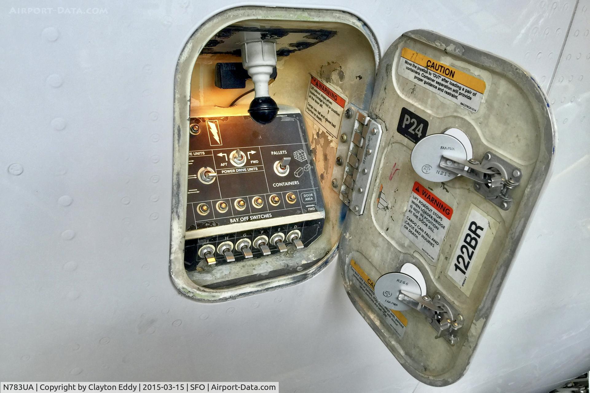 N783UA, 1997 Boeing 777-222/ER C/N 26950, Last Boeing 777 C check at SFO. Cargo door control panel. 2015.