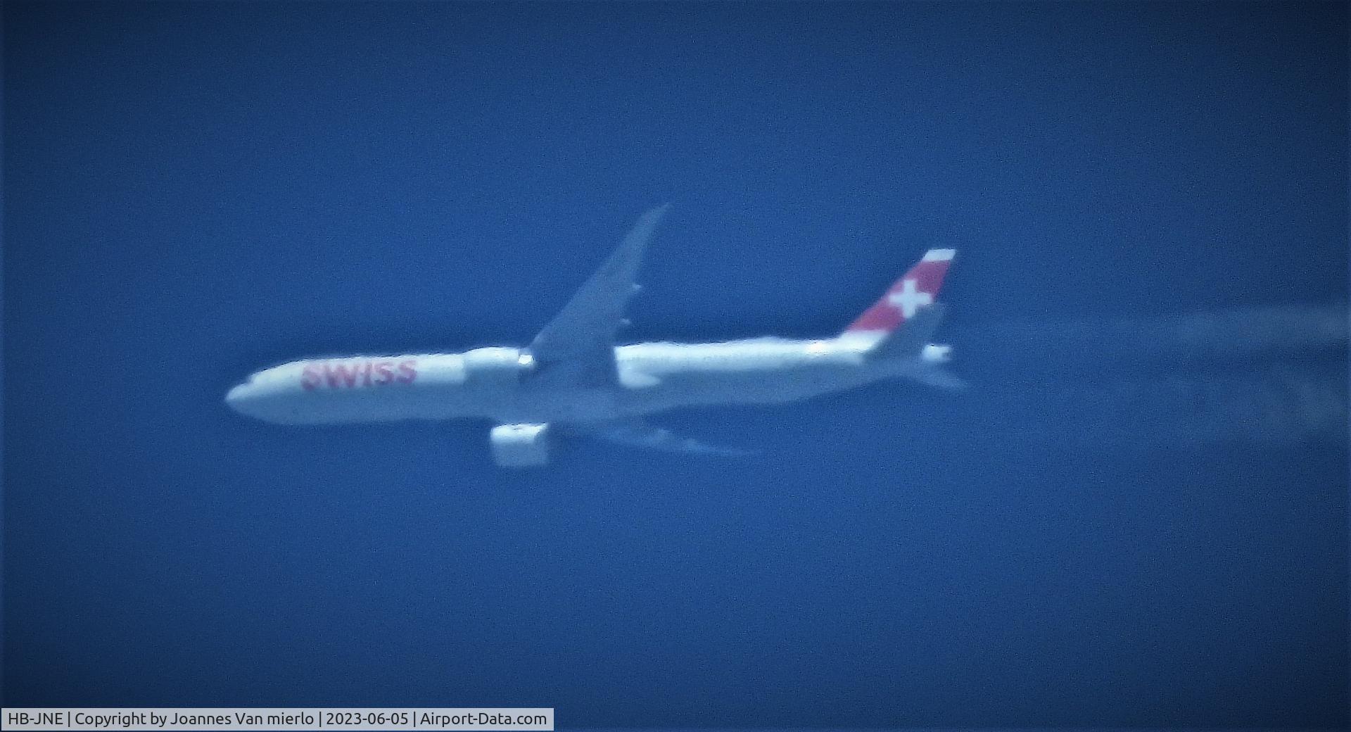 HB-JNE, 2016 Boeing 777-3DE/ER C/N 44586, Cruising over Belgium