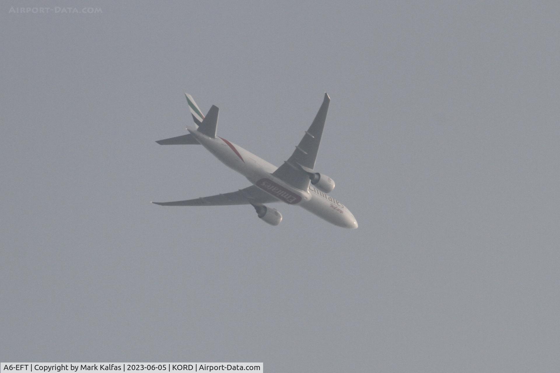 A6-EFT, 2022 Boeing 777F C/N 67462, Emarites B77L A6-EFT operating as UAE9989 from LCK-ORD, on approach to O'Hare in smoke filled skies from the Canadian wildfires