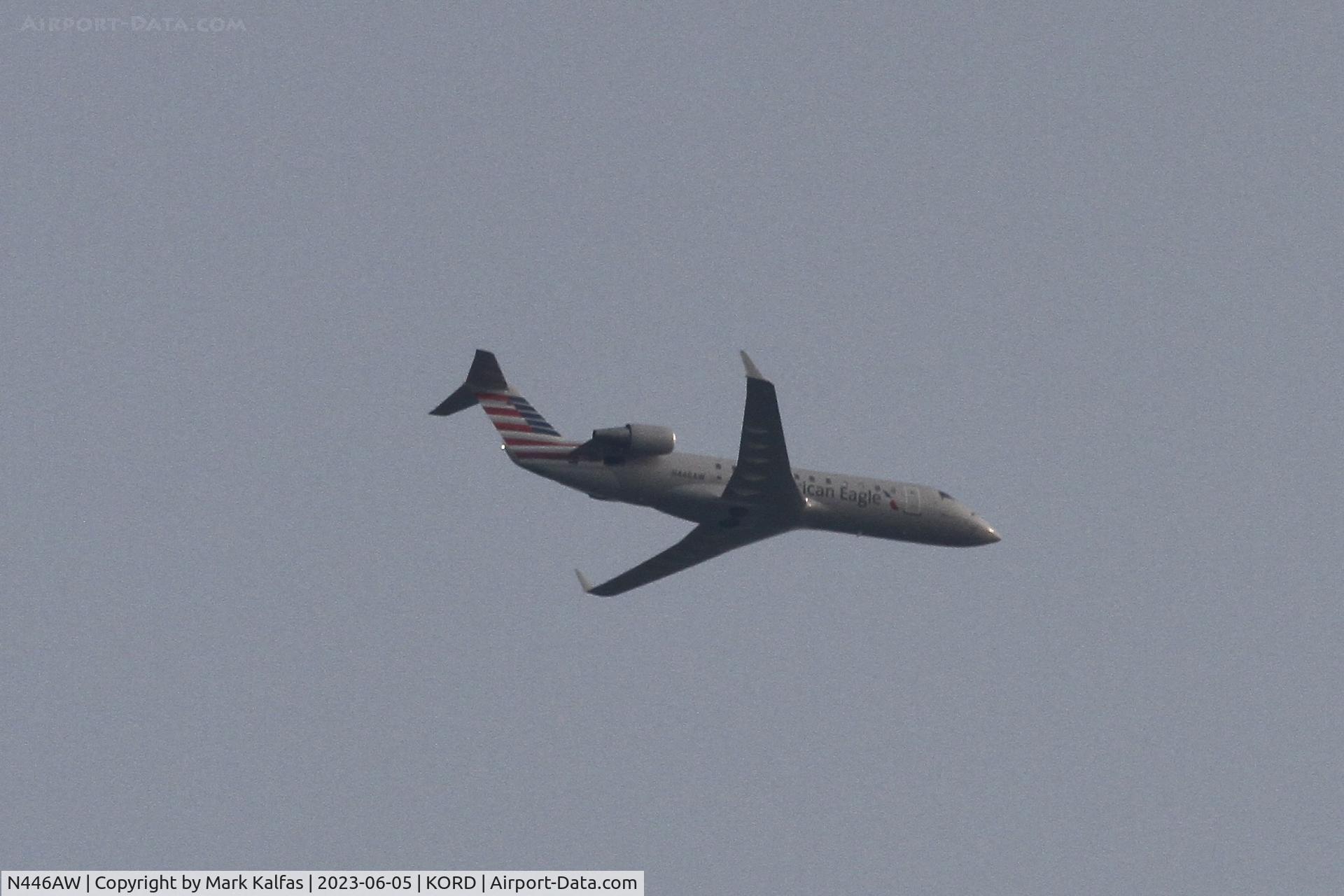 N446AW, 2003 Canadair CRJ-200LR (CL-600-2B19) C/N 7806, Air Wisconsin/ American Eagle CRJ2 N446AW operating as AWI6222 from RIC-ORD, arriving at O'Hare in smoke filled skies from the Canadian wildfires