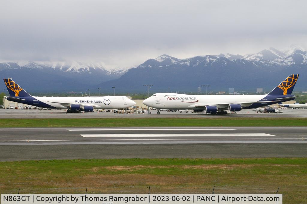 N863GT, 2023 Boeing 747-8F C/N 67150, Atlas Air Boeing 747-8F (N863GT) taxiing in with Atlas Air Boeing 747-8F (N862Gt) already on position. Left to right both are the last ever build Boeing 747 in one frame.
