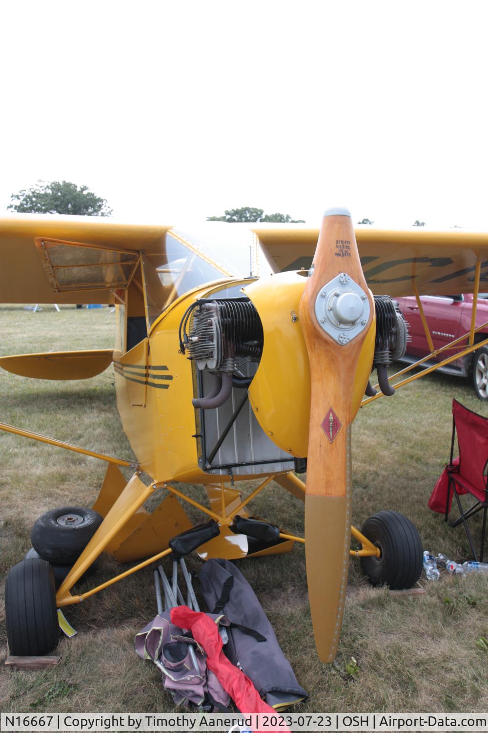 N16667, 1936 Taylor J-2 Cub C/N 682, 1936 Taylor J-2, c/n: 682, one bladed propeller.  There's an axis that 45 degrees through the hub that allows the propeller pitch to change in flight for better climb and cruise performance.  AirVenture 2023. Follow the link for more info one blade props