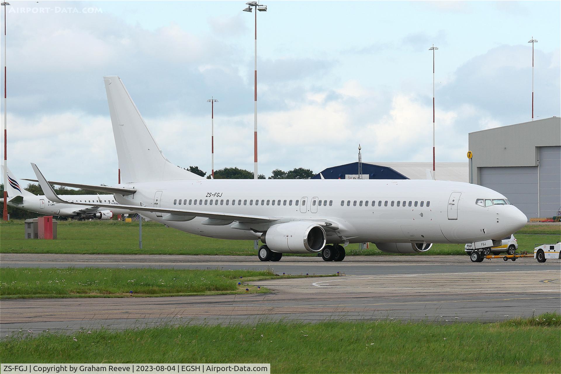 ZS-FGJ, 2009 Boeing 737-800 C/N 37542, Under tow at Norwich.