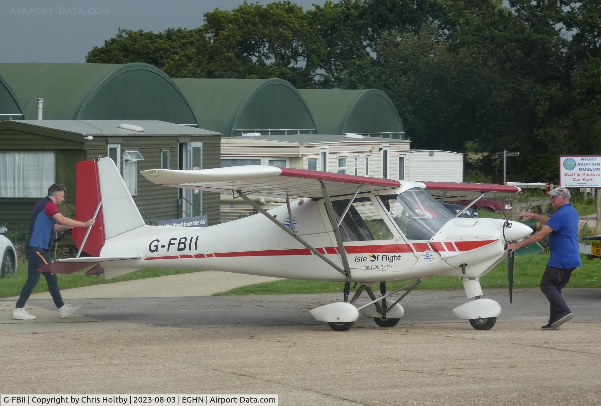 G-FBII, 2003 Comco Ikarus C42 FB100 C/N 0310-6574, Manually pushed to hangar at Sandown Airport (EGHN) Isle of Wight