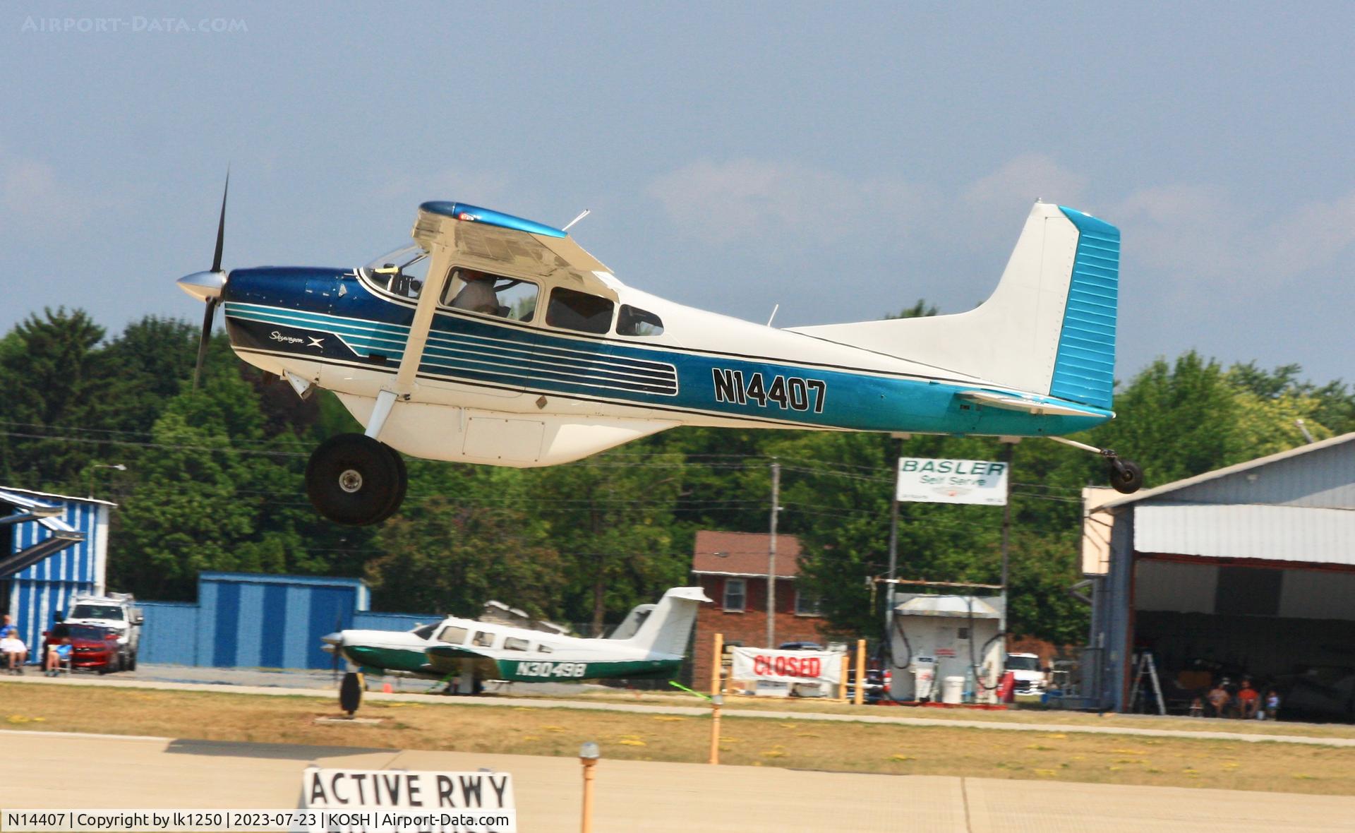 N14407, 1964 Cessna 185C Skywagon C/N 185-0676, This Cessna Skywagon X is landing for EAA Air Venture 2023