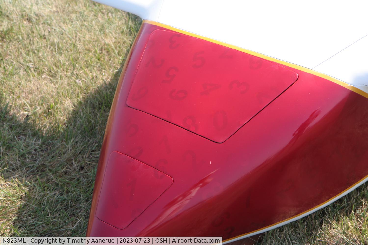 N823ML, 2021 COZY MKIV C/N 0049, 2021 COZY MKIV, c/n: 0049, AirVenture 2023.  Lucky Numbers.  Silver numbers were applied first, then an overcoat of red paint was applied.