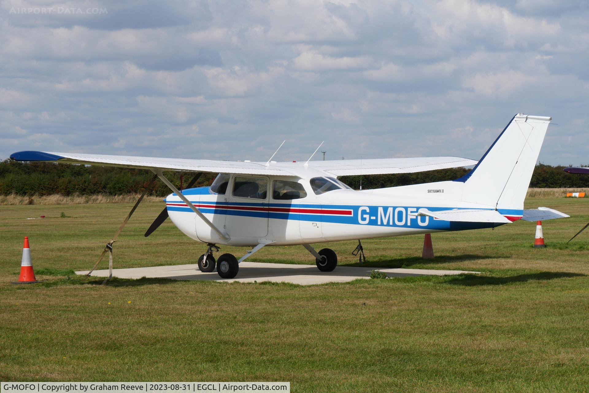 G-MOFO, 1974 Reims Cessna F172M Skyhawk C/N 1192, Par ked at Fenland.
