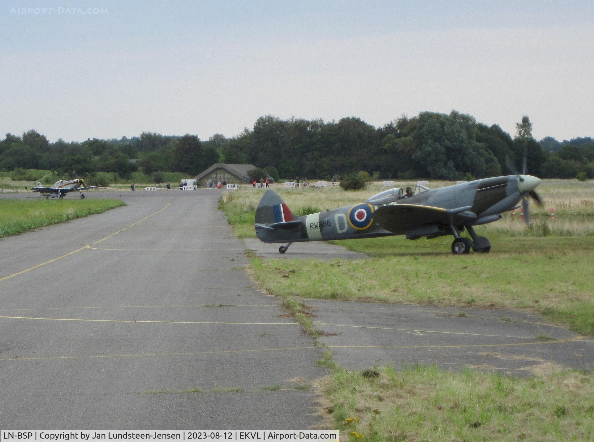 LN-BSP, 1945 Vickers Supermarine. Spitfire MK.XVIe C/N CBAF.IX.4644, Spitfire LN-BSP and Mustang LN-BMU in the background 
arriving at an airshow at Vaerloese, Denmark after landing on 
Runway 10. Spitfire built in 1945 as RAF RW386 / NG-D.
