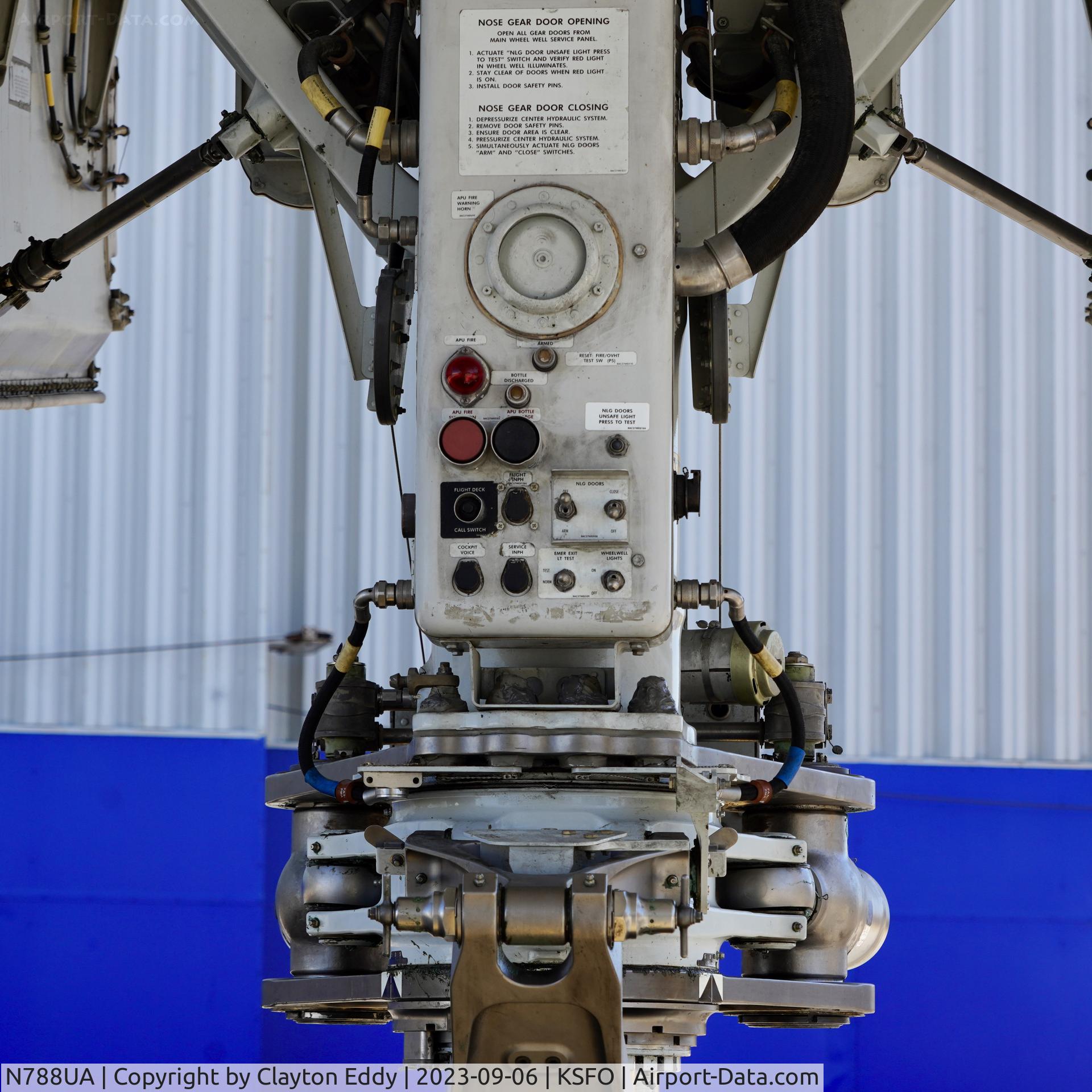 N788UA, 1997 Boeing 777-222 C/N 26942, Nose gear. SFO. 2023.