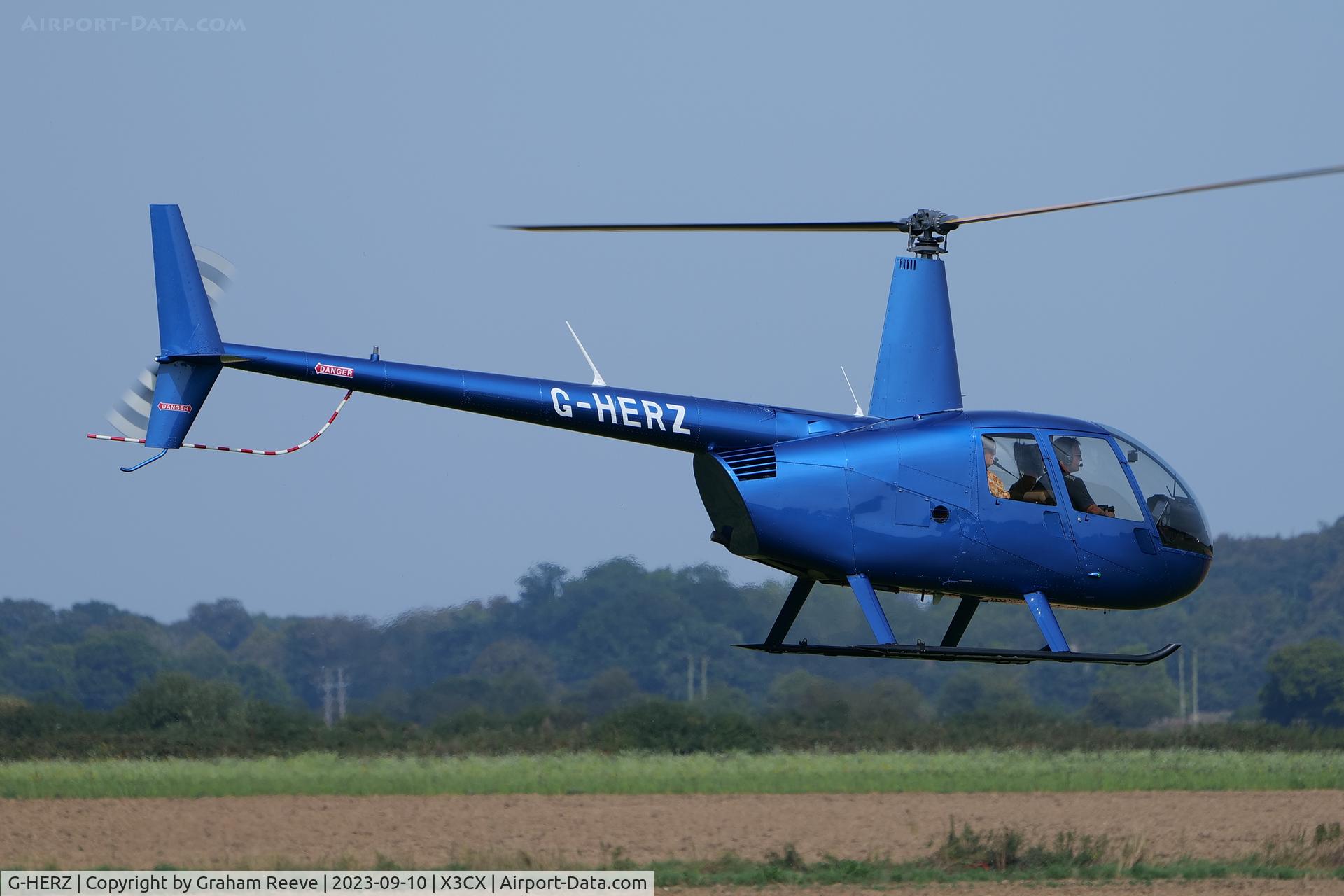 G-HERZ, 1997 Robinson R44 Astro C/N 0381, Landing at Northrepps.