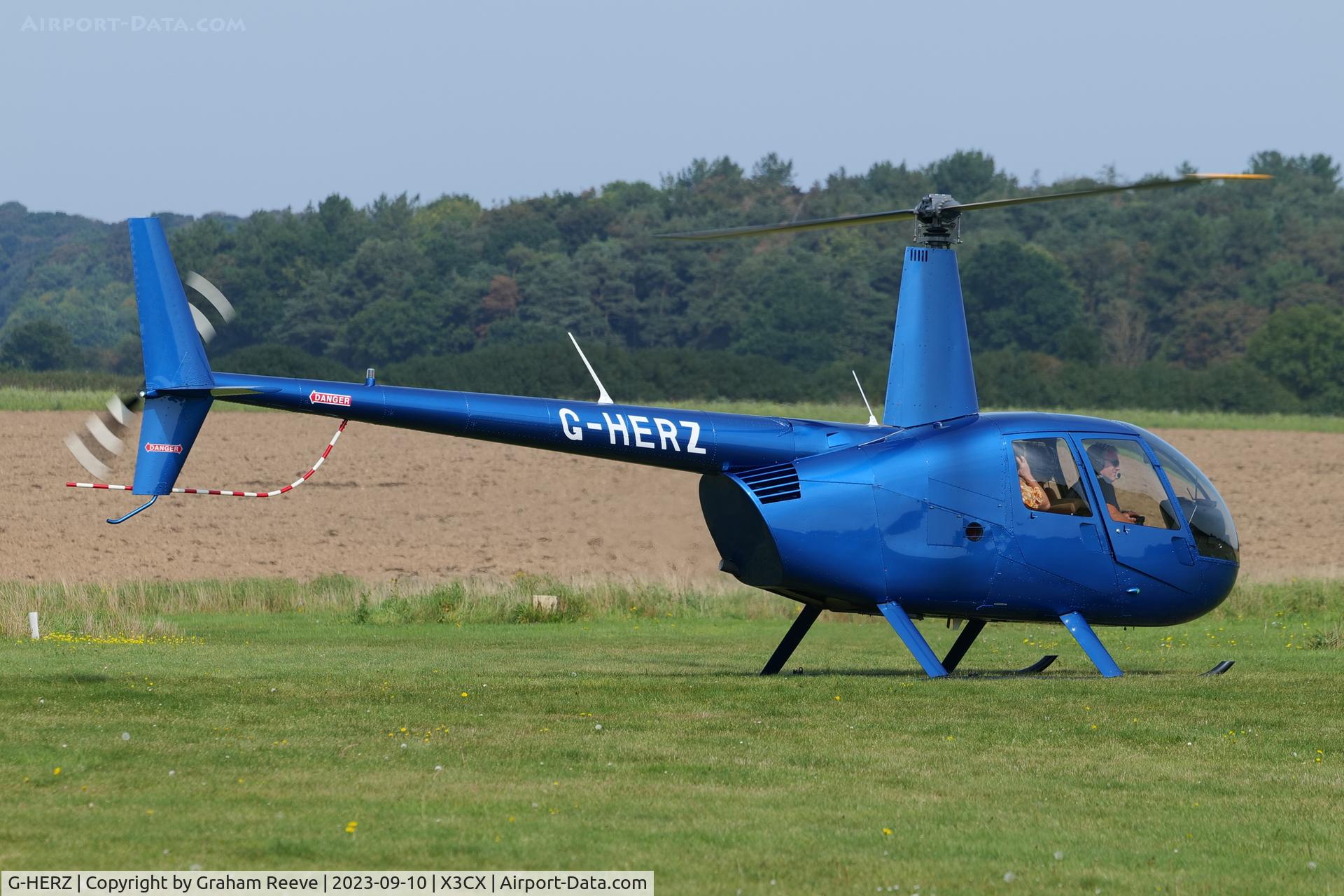 G-HERZ, 1997 Robinson R44 Astro C/N 0381, Just landed at Northrepps.