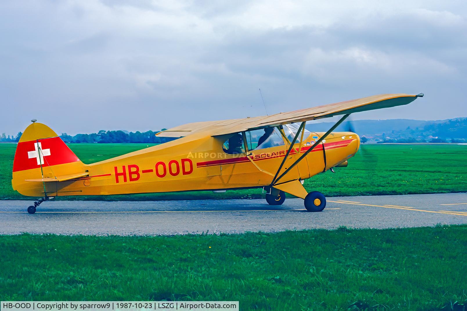 HB-OOD, 1946 Piper PA-12 Super Cruiser C/N 12-558, Departing to its new owner in Denmark. HB-registered from 1947-01-31 until 1988-02-16.Scanned from a slide.