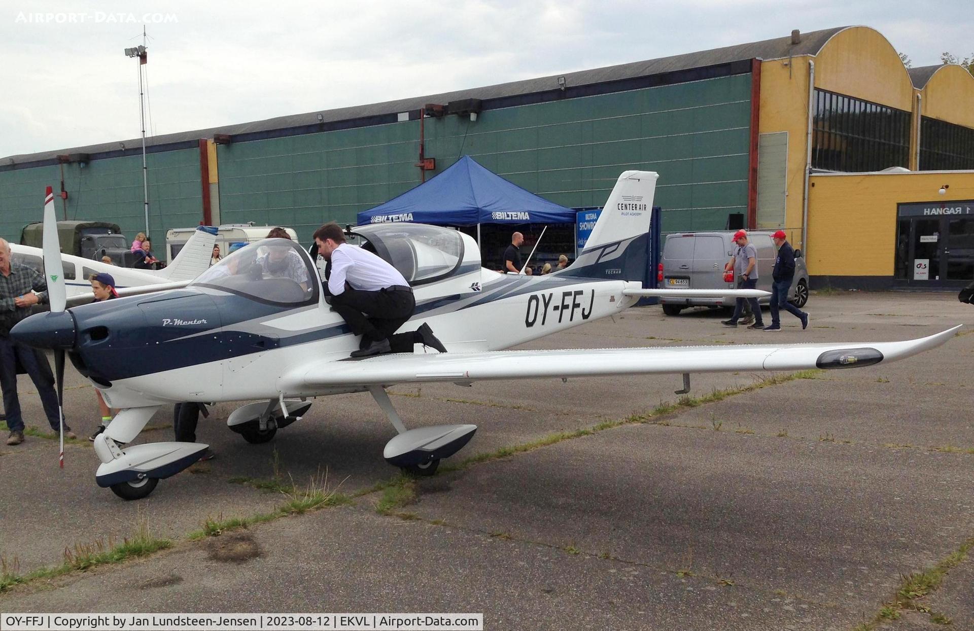OY-FFJ, 2022 Tecnam P2002 P-Mentor C/N 1025, P-Mentor OY-FFJ of Center Air Pilot Academy seen at an airshow 
at Vaerloese in Denmark. The pilot on the wing is explaining the 
cockpit to some spectators.