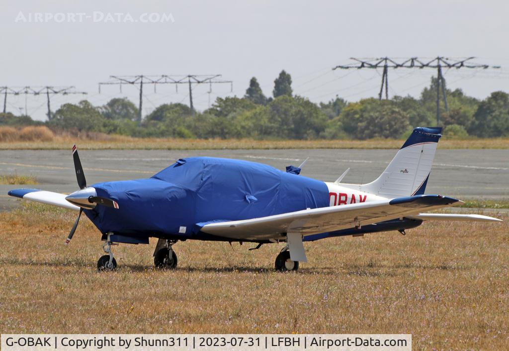 G-OBAK, 1977 Piper PA-28R-201T Cherokee Arrow III C/N 28R-7703054, Parked in the grass...