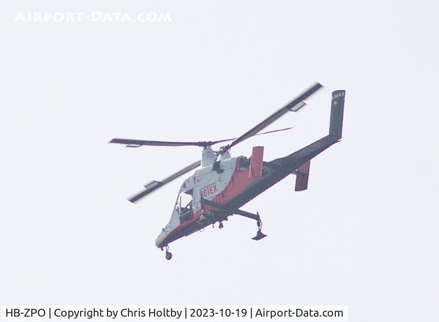 HB-ZPO, 2021 Kaman K-1200 K-Max C/N A94-0055, Over Potters Bar, Herts. The 'synchropter' has two rotors rotating in opposite circles & is known as the aerial truck.