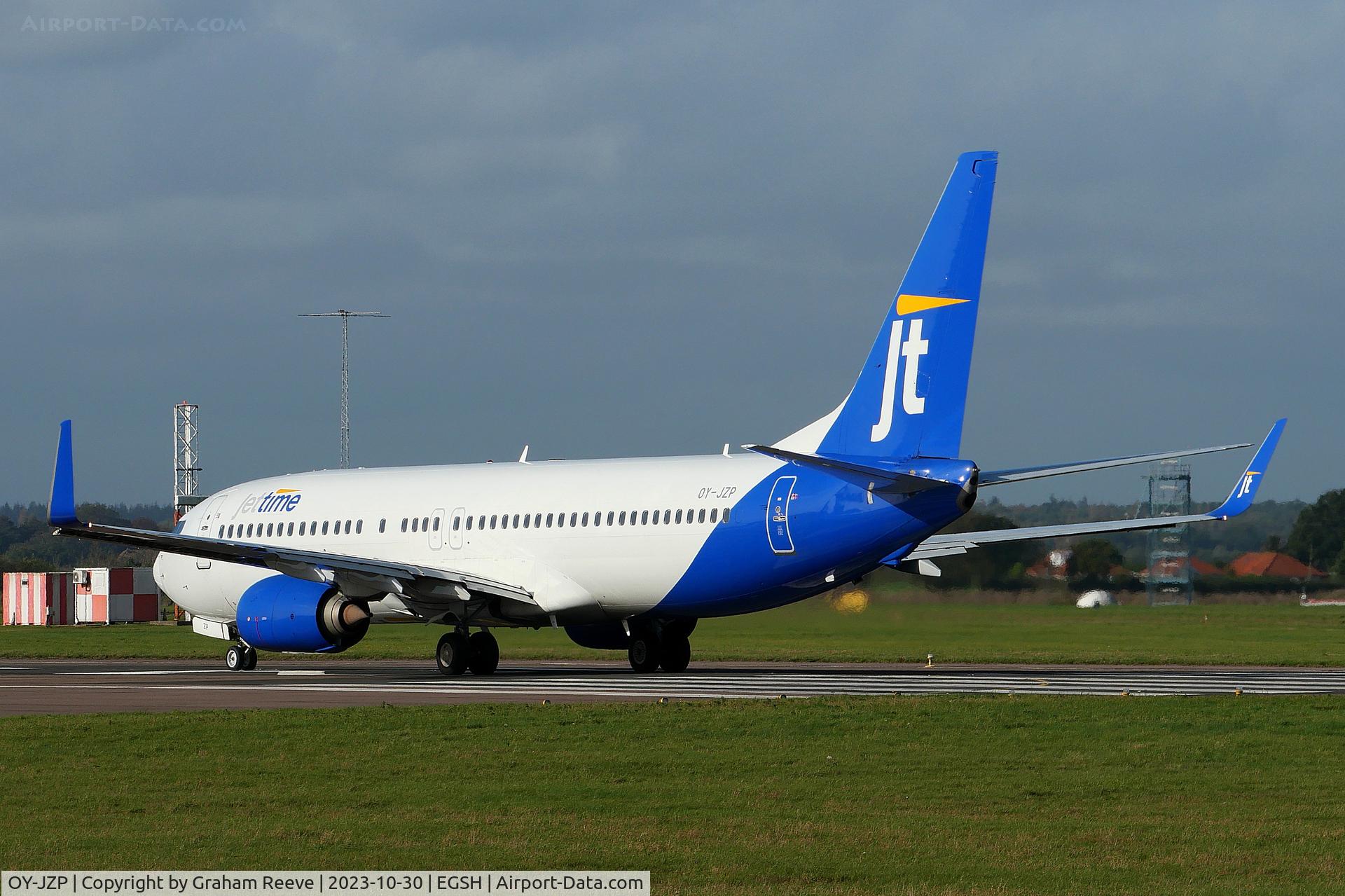 OY-JZP, 2011 Boeing 737-8U3 C/N 38071, Departing from Norwich.