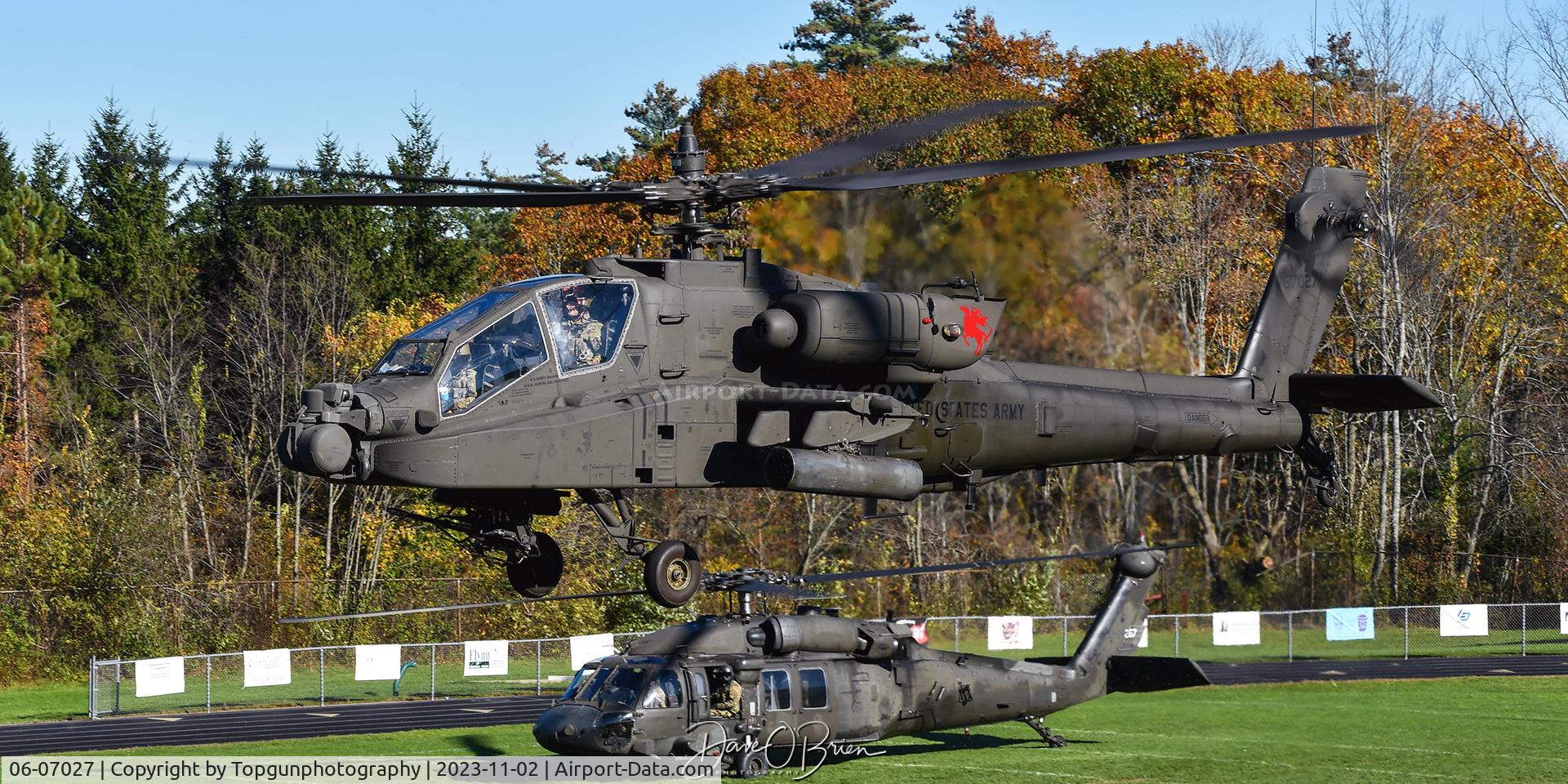 06-07027, 2007 Boeing AH-64D C/N DUS027, GUARD027 hovering over the football field.