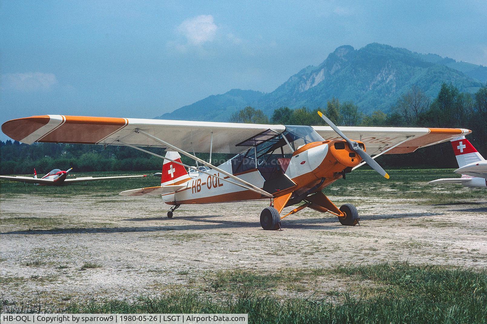 HB-OQL, 1951 Piper L-18C Super Cub C/N 18-1613, In an older paint scheme at its base. Scanned from a slide.