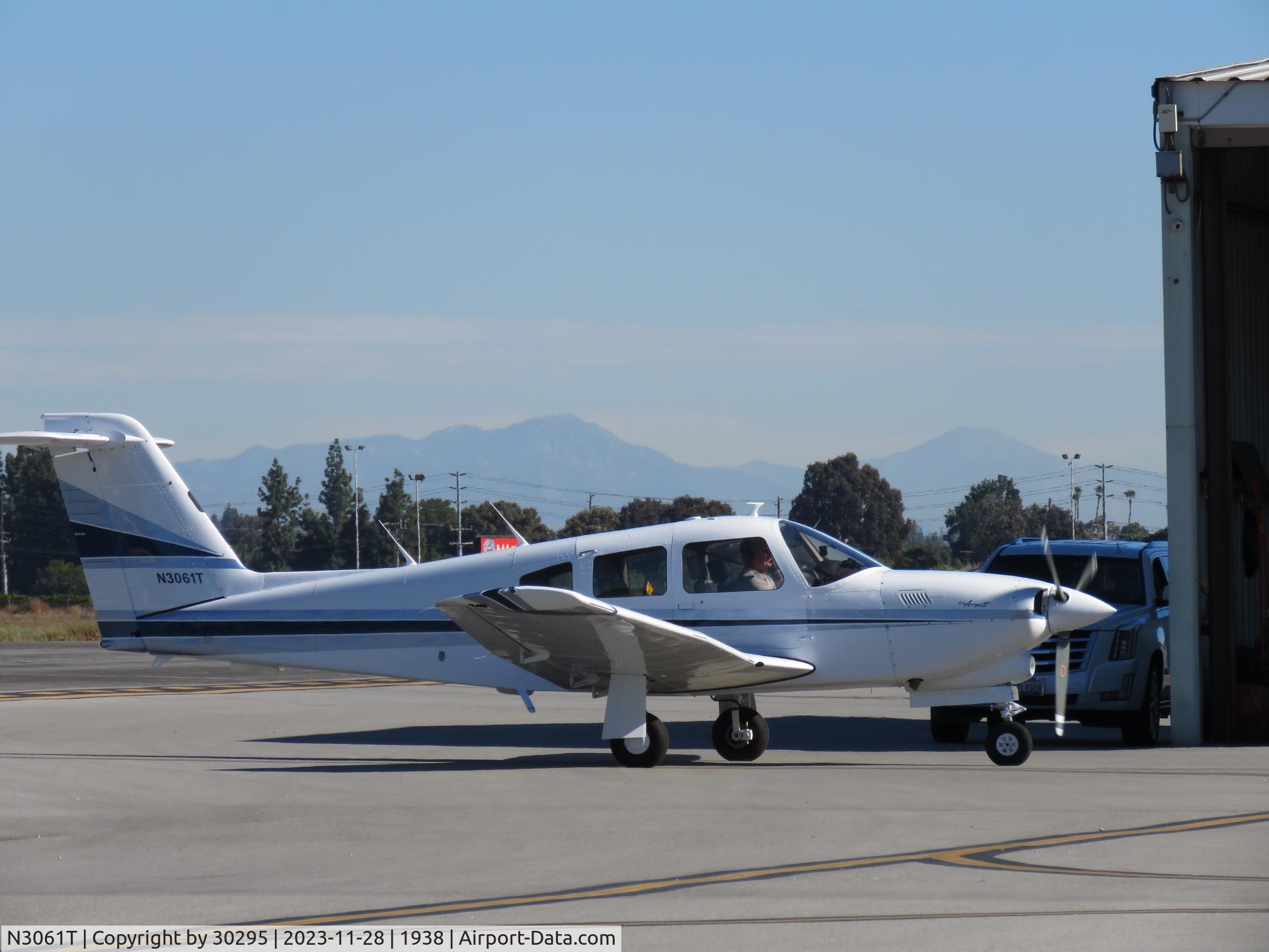 N3061T, 1979 Piper PA-28RT-201T Arrow IV C/N 28R-7931088, Stopping at a hanger