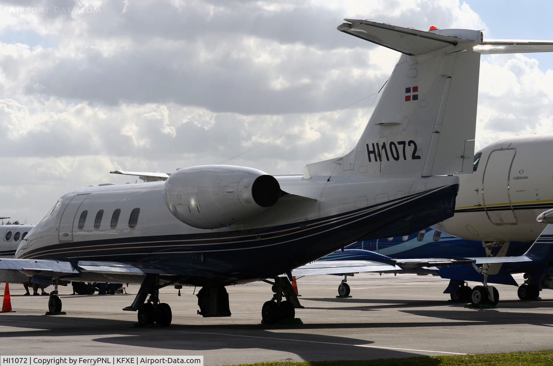 HI1072, 1984 Learjet 55 C/N 55-101, Tugged away between other stationary planes is this Learjet 55