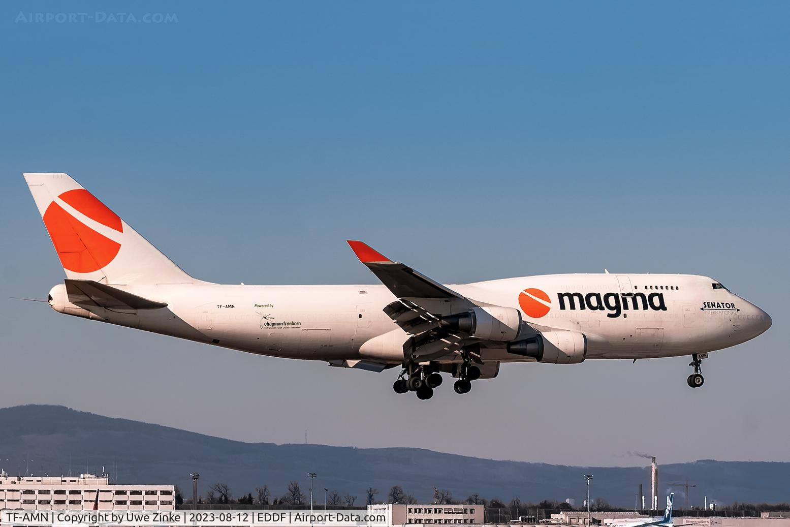 TF-AMN, 1998 Boeing 747-4F6 C/N 27602, Short final, taken to a meshwired fence