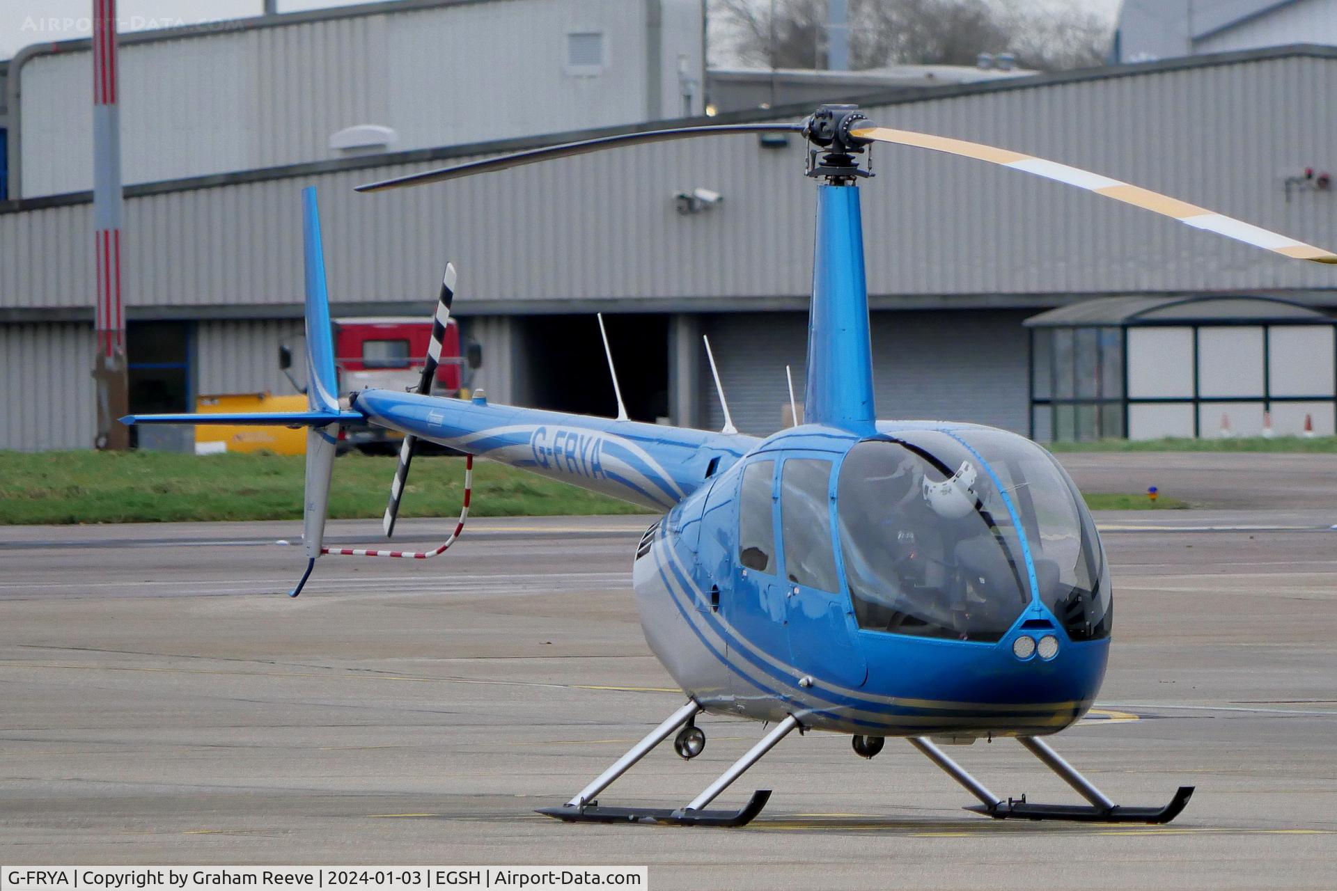 G-FRYA, 2006 Robinson R44 Raven II C/N 11605, Parked at Norwich.