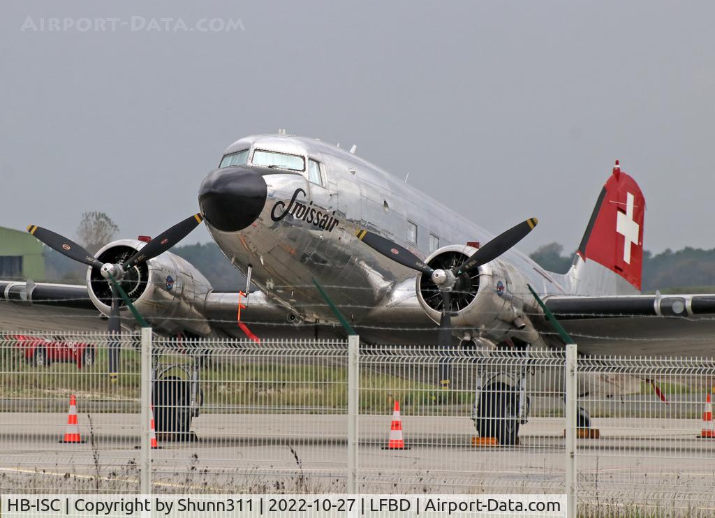 HB-ISC, 1943 Douglas DC-3C-S1C3G (C-47A) C/N 9995, Parked at the Cargo apron and not easy to catch with 2 fences...