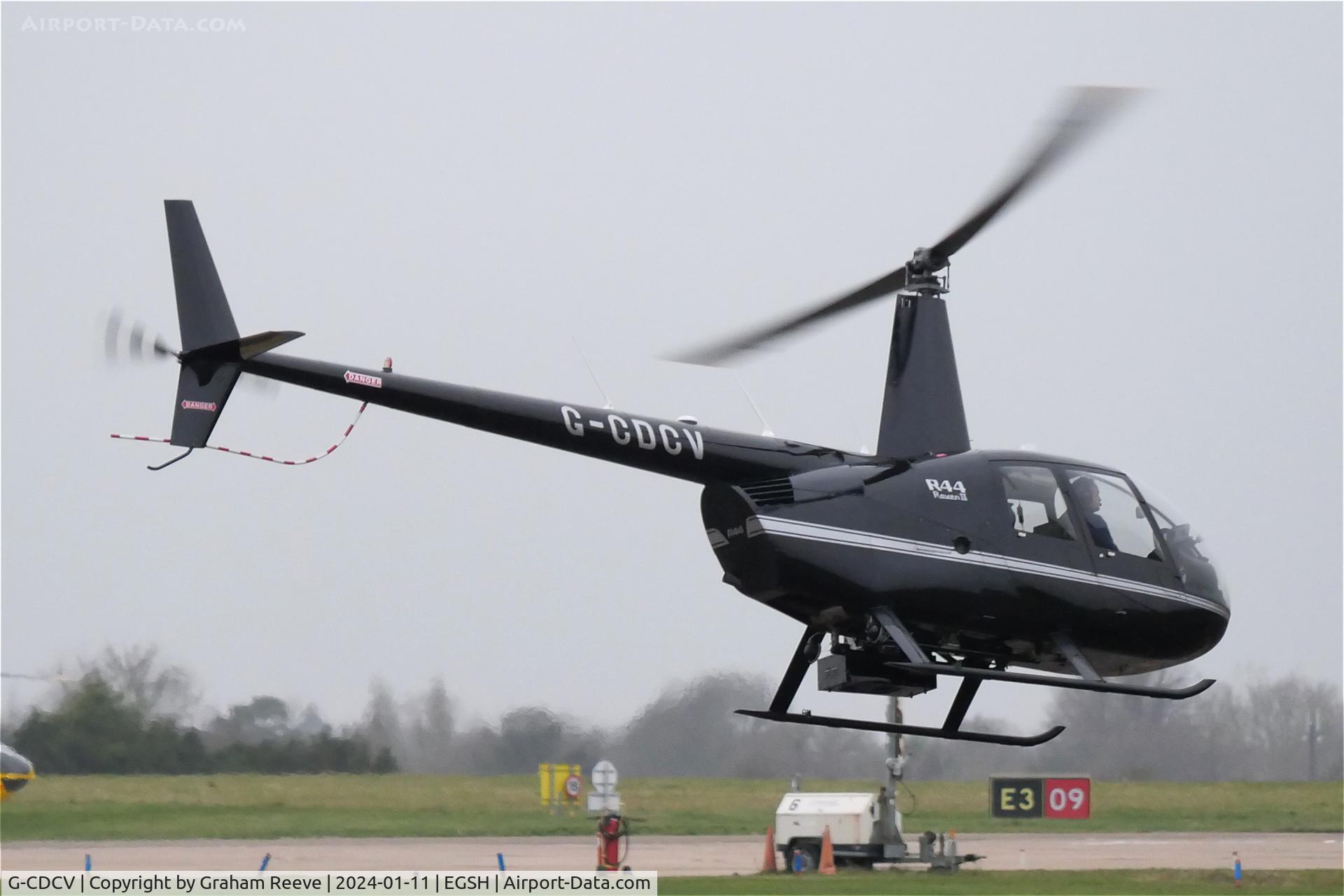 G-CDCV, 2004 Robinson R44 Raven II C/N 10536, Departing from Norwich.