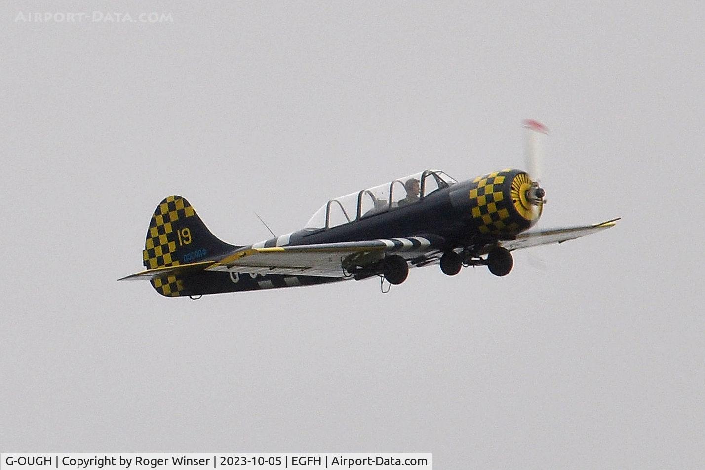 G-OUGH, 1987 Bacau Yak-52 C/N 877404, Resident aircraft approaching Runway 22.