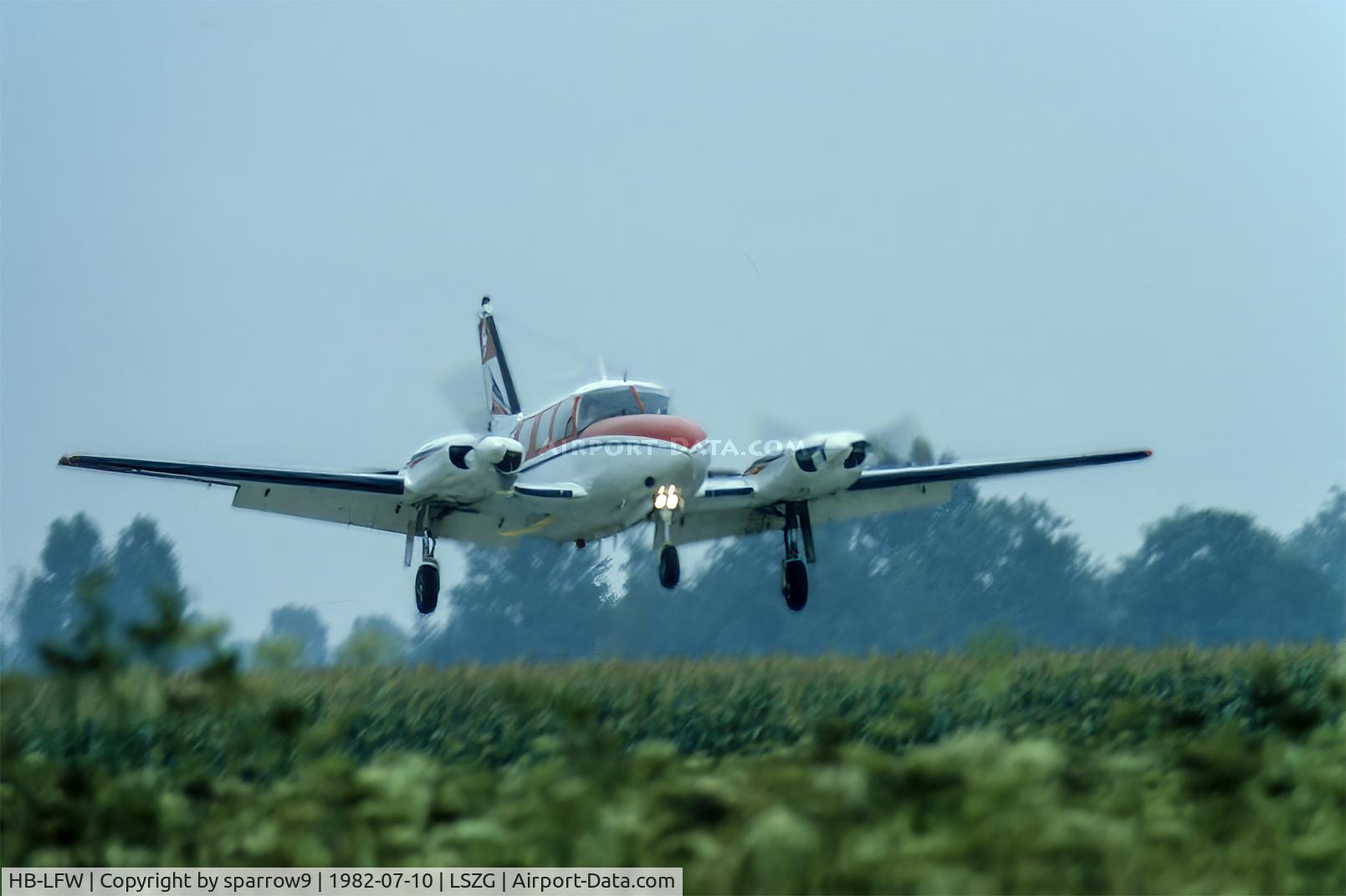 HB-LFW, 1968 Piper PA-31-310 Navajo C/N 31-188, On short-final Grenchen. Unsure of date. Scanned from a slide.