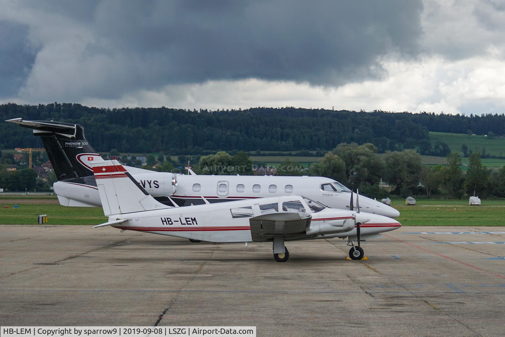 HB-LEM, 1973 Piper PA-34-200 Seneca C/N 34-7350327, Beside a bigger brother below a dark sky. HB-registered from 1973-10-09 until 2020-04-06.
