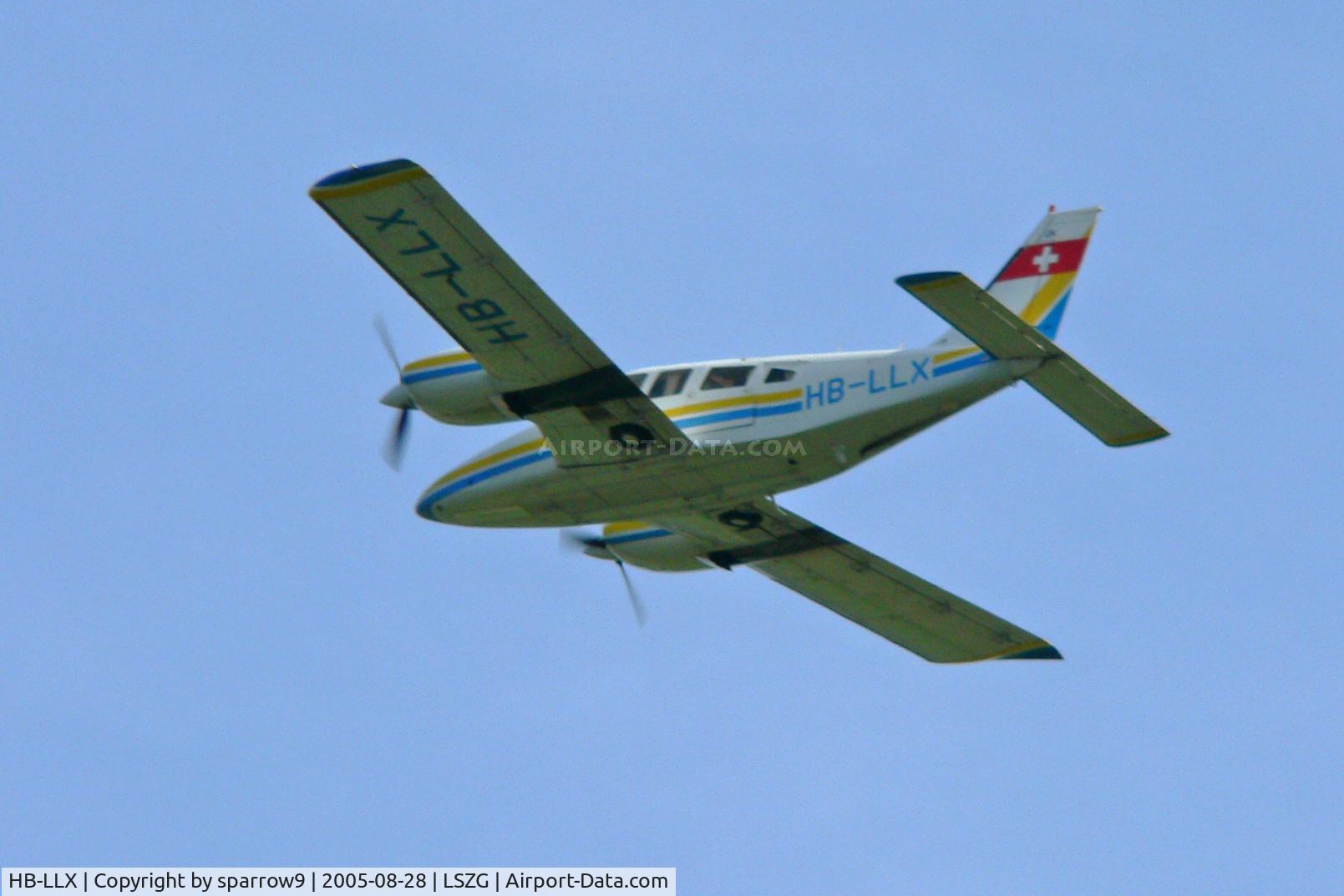 HB-LLX, 1980 Piper PA-34-200T Seneca II C/N 34-8070232, On a low go-around at Grenchen. HB-registered from 1980-05-21 until 2010-08-26. Scanned from a slide.