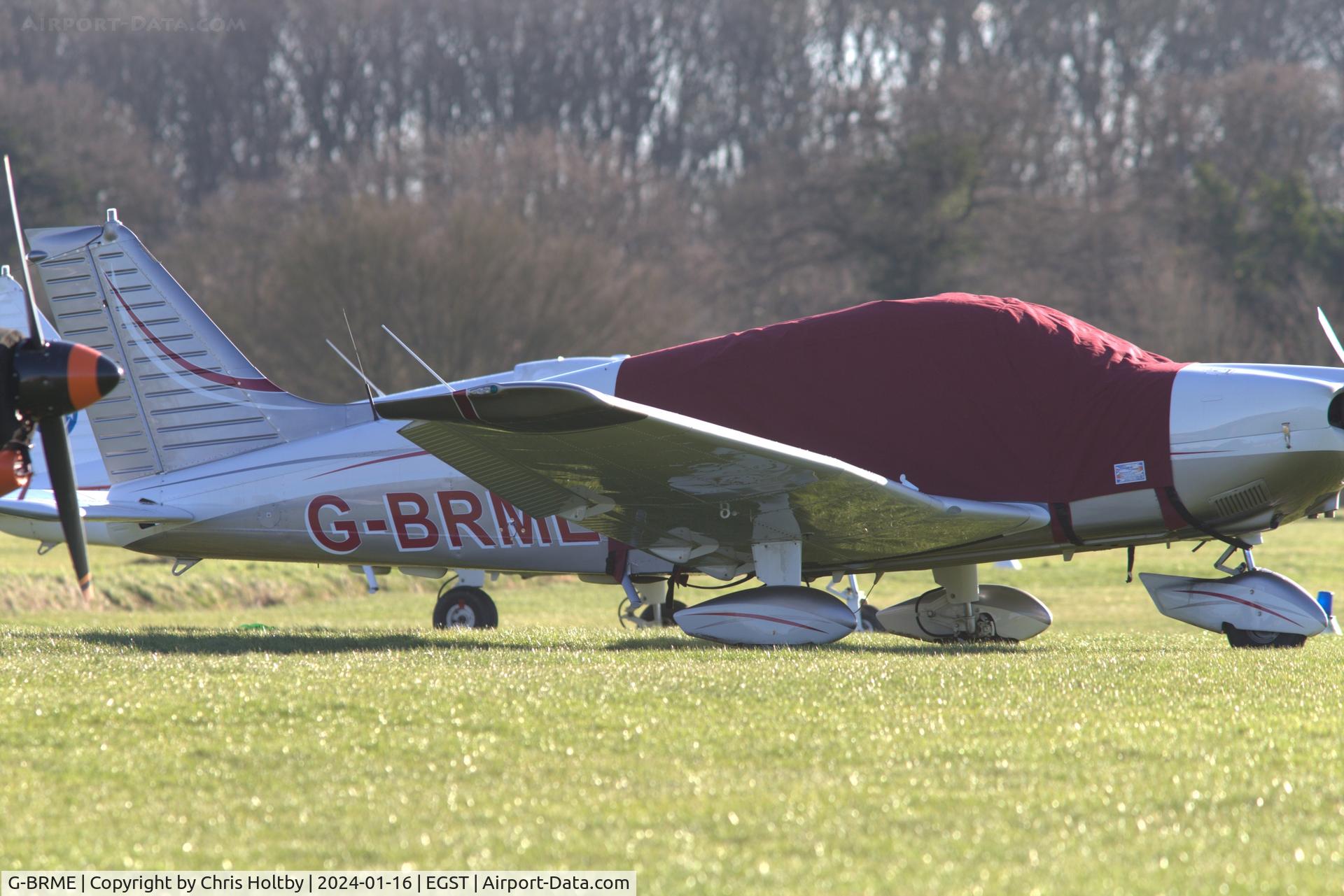 G-BRME, 1977 Piper PA-28-181 Cherokee Archer II C/N 28-7790105, Sporting a smart new paint job and wheel farings at Elmsett, Suffolk.