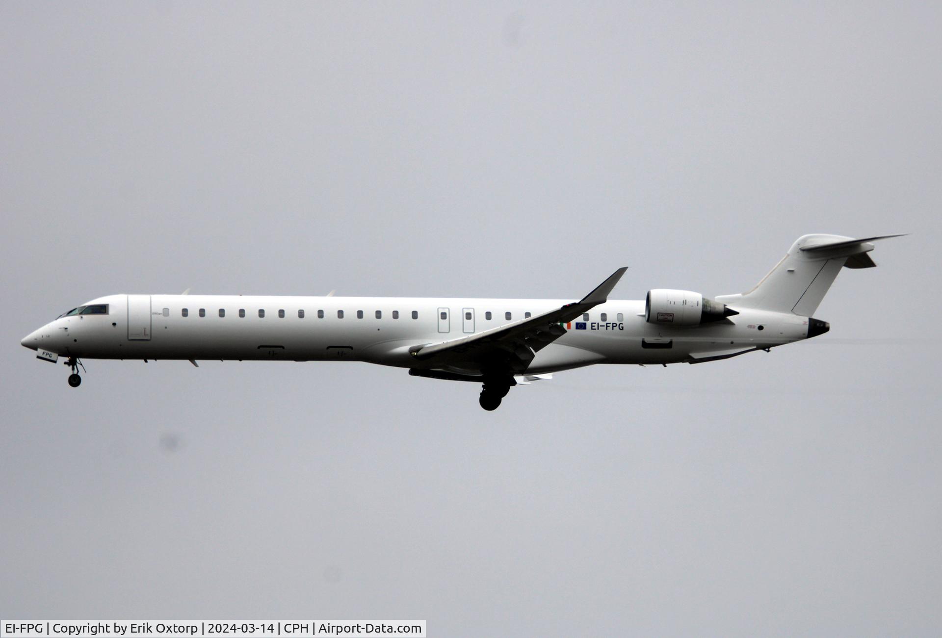 EI-FPG, 2016 Bombardier CRJ-900LR (CL-600-2D24) C/N 15406, EI-FPG landing rw 22L.  Now all white