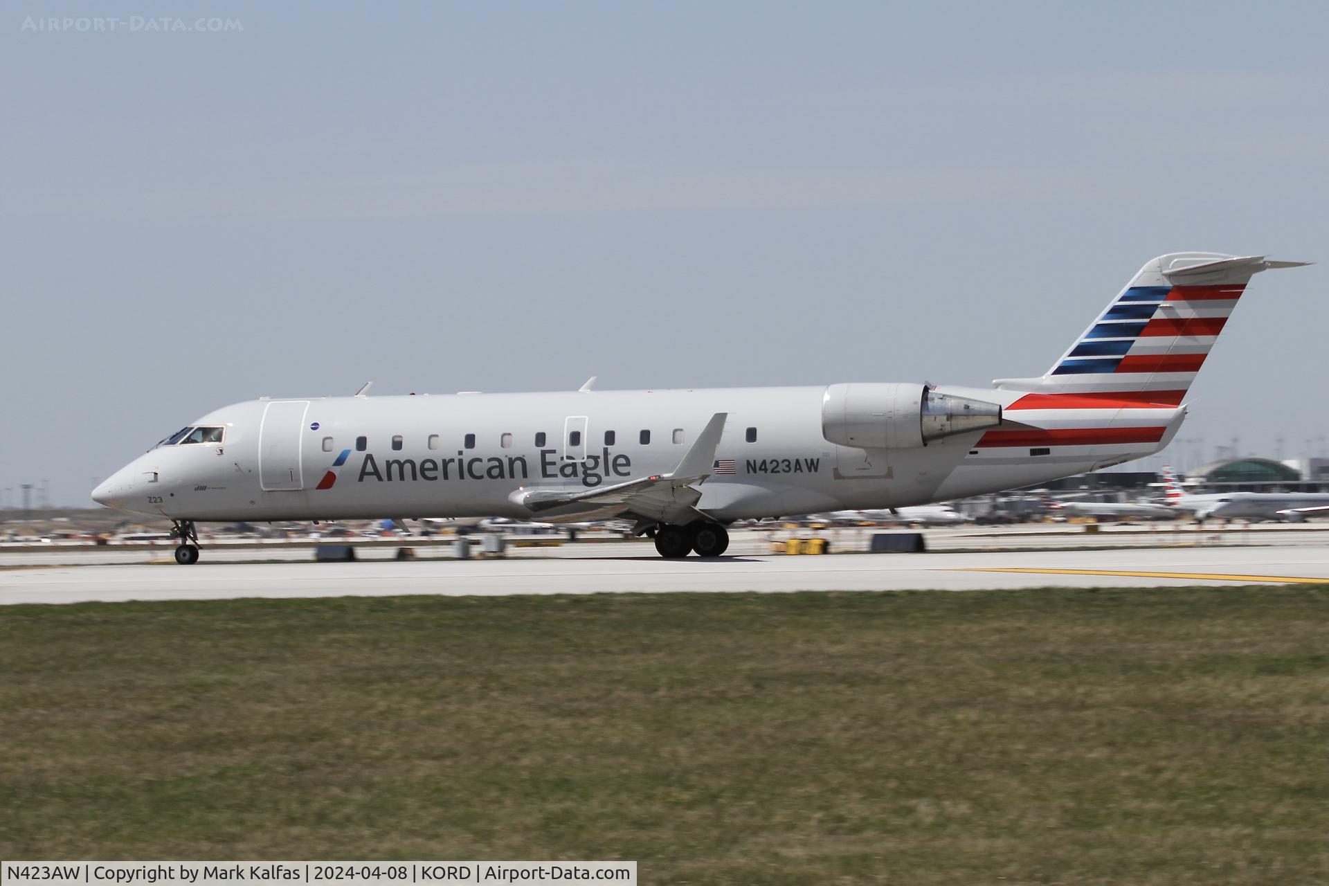 N423AW, 2002 Bombardier CRJ-200LR (CL-600-2B19) C/N 7636, CRJ2 Air Wisconsin/American Eagle Canadair Regional Jet CRJ-200 N423AW AWI6007  ORD-MEM departing on 22L ORD during the solar eclipse