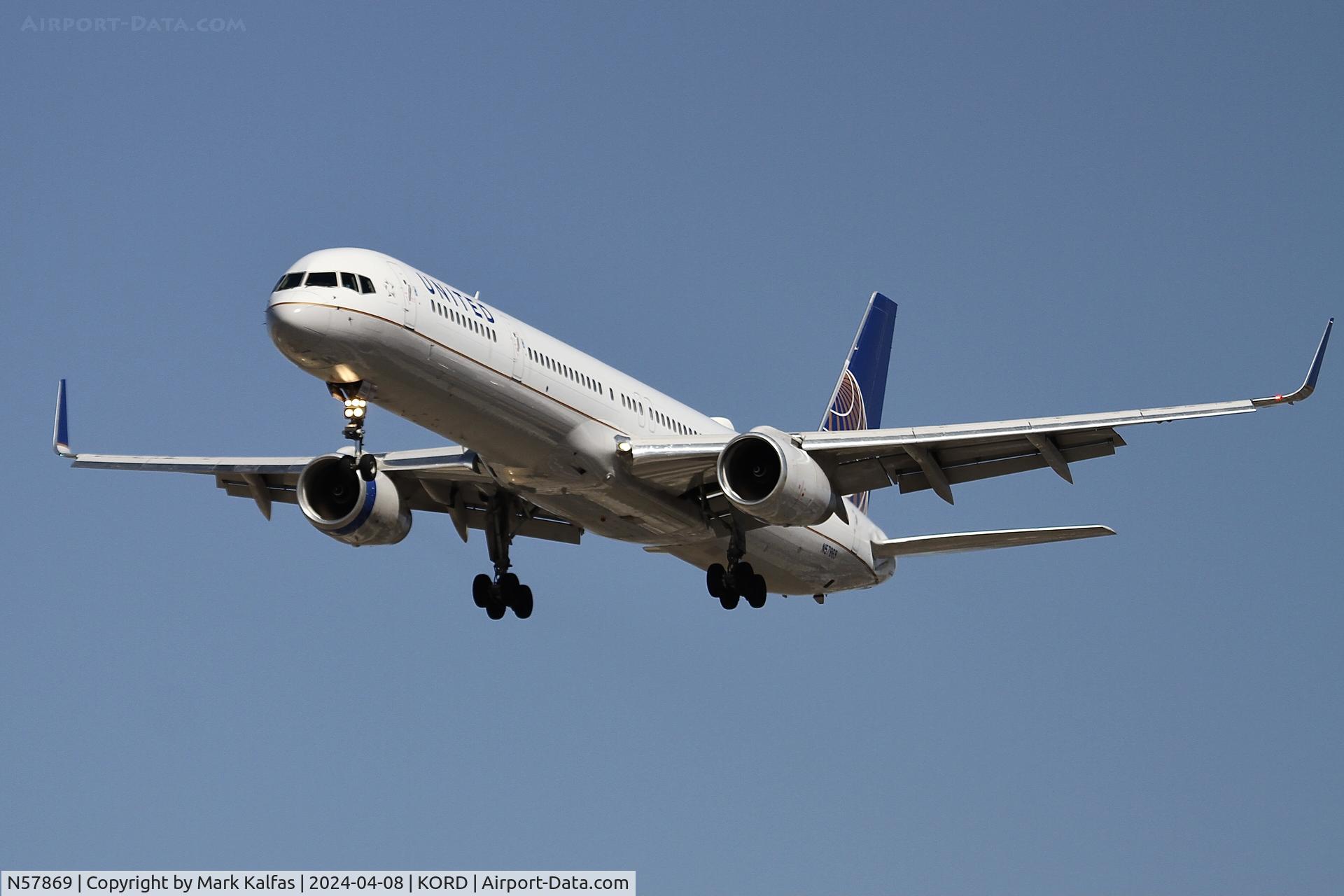 N57869, 2002 Boeing 757-33N C/N 32593, B753 United Airlines Boeing 757-33N N57869 UAL2475 N57869 UAL2475 arriving 28C ORD during the Solar Eclipse