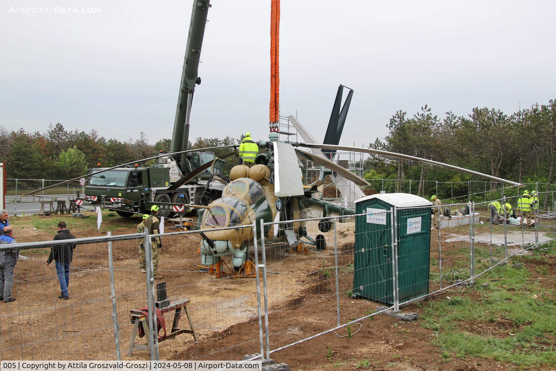 005, 1983 Mil Mi-24D Hind C/N 340275, Displayed as a memorial on the road leading to the former Szentkirályszabadjai Airport. It was given page number 005 in memory of the first Mi-24 combat helicopter to arrive in Hungary. Installation moments.