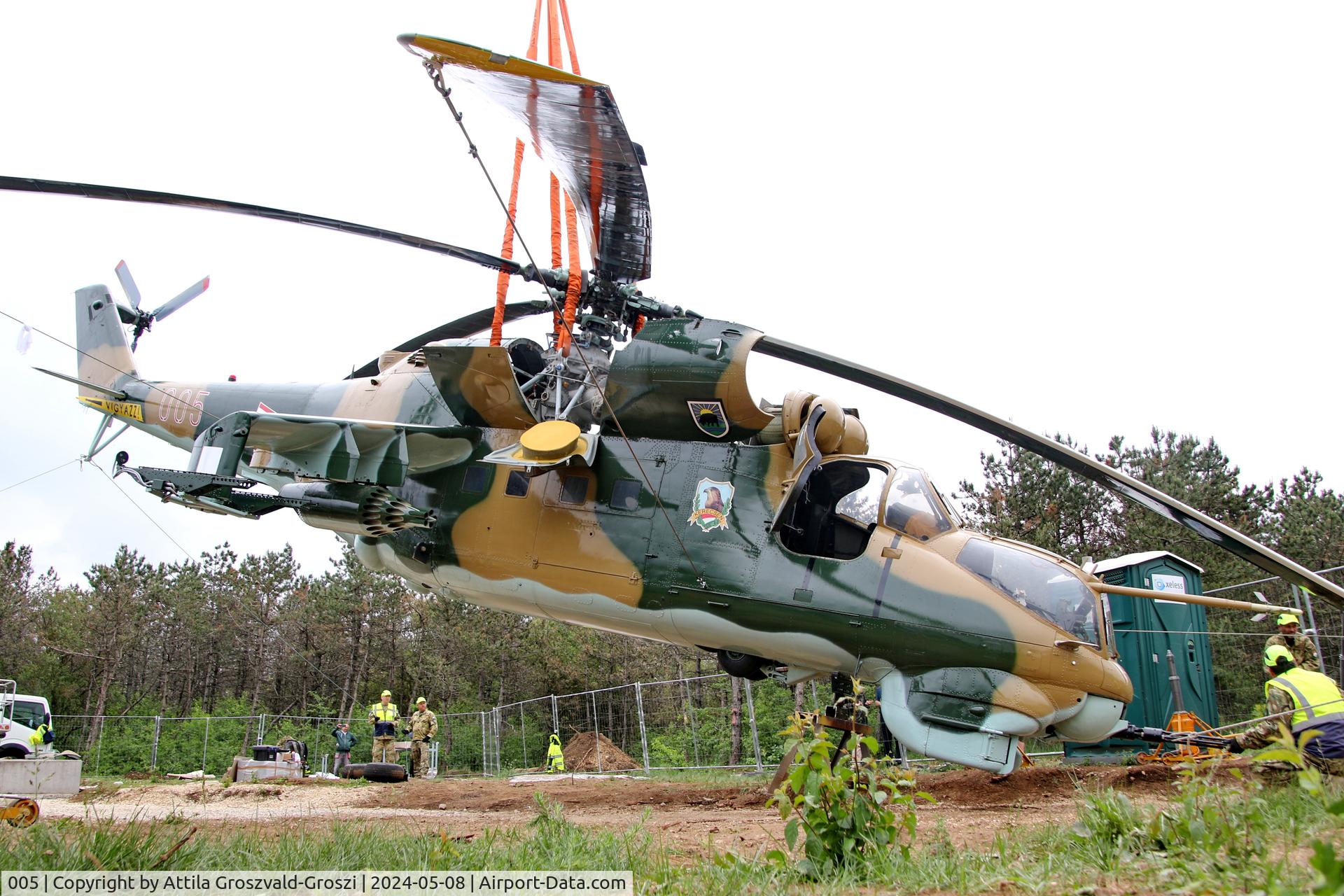 005, 1983 Mil Mi-24D Hind C/N 340275, Displayed as a memorial on the road leading to the former Szentkirályszabadjai Airport. It was given page number 005 in memory of the first Mi-24 combat helicopter to arrive in Hungary. Installation moments.