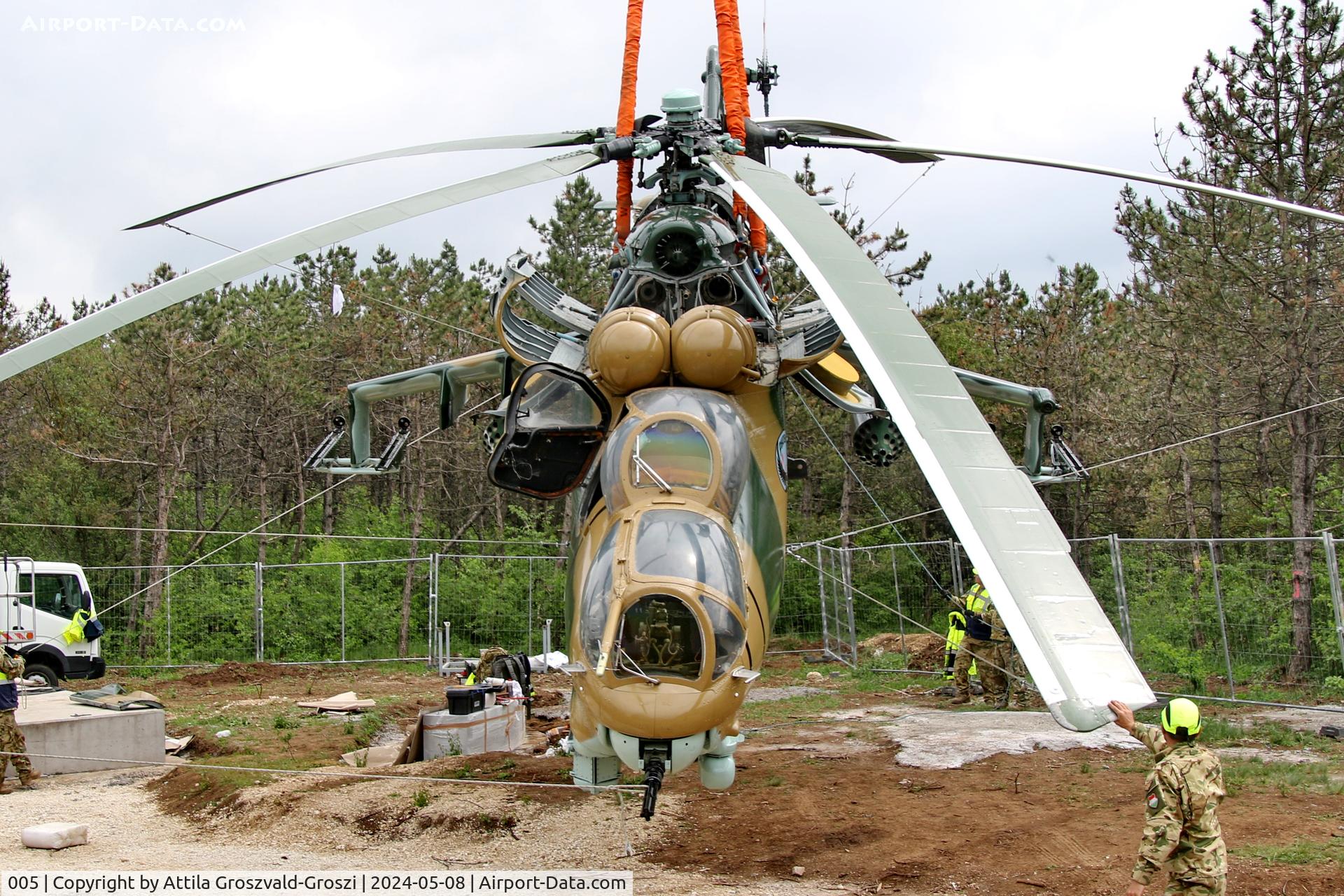 005, 1983 Mil Mi-24D Hind C/N 340275, Displayed as a memorial on the road leading to the former Szentkirályszabadjai Airport. It was given page number 005 in memory of the first Mi-24 combat helicopter to arrive in Hungary. Installation moments.