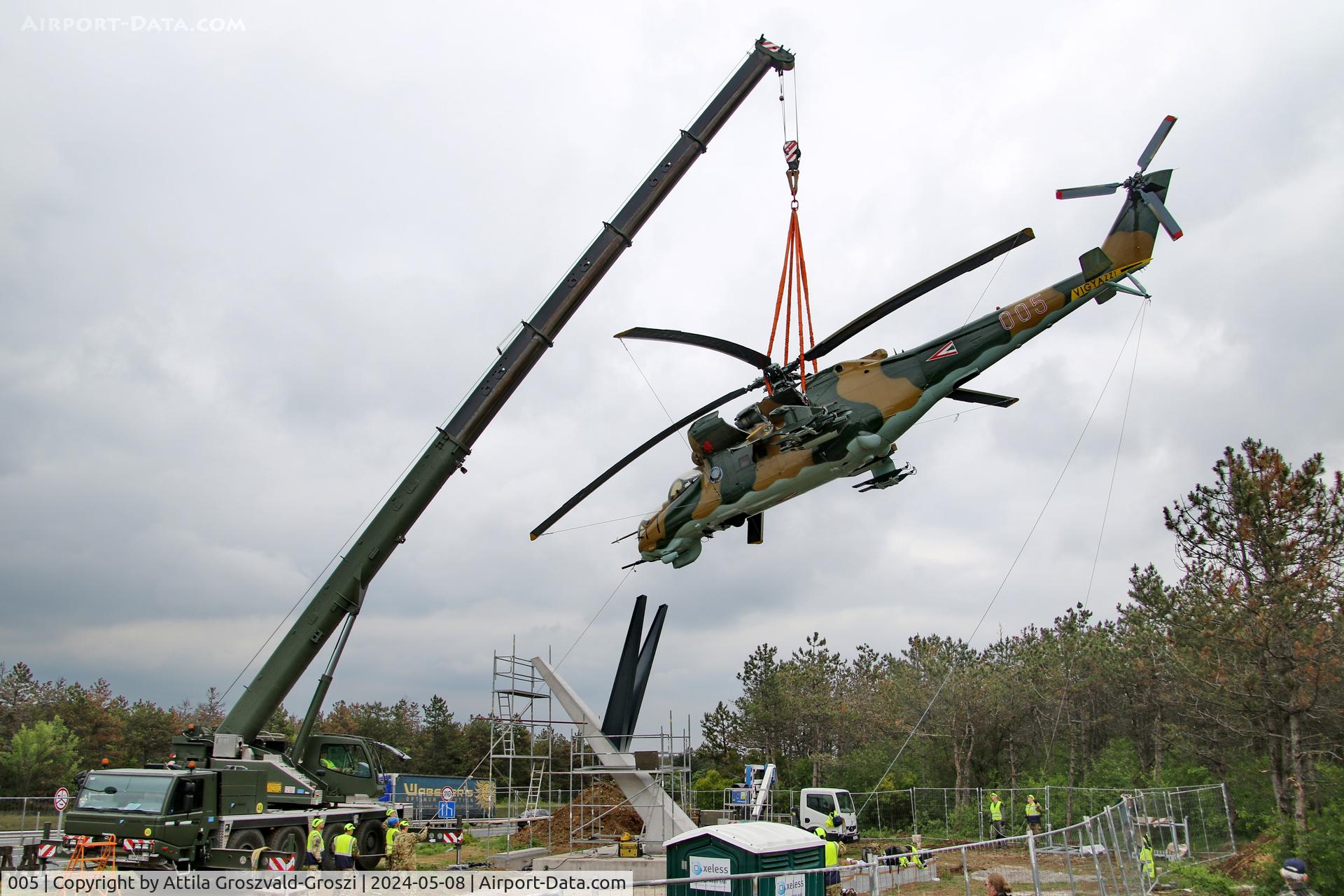 005, 1983 Mil Mi-24D Hind C/N 340275, Displayed as a memorial on the road leading to the former Szentkirályszabadjai Airport. It was given page number 005 in memory of the first Mi-24 combat helicopter to arrive in Hungary. Installation moments.