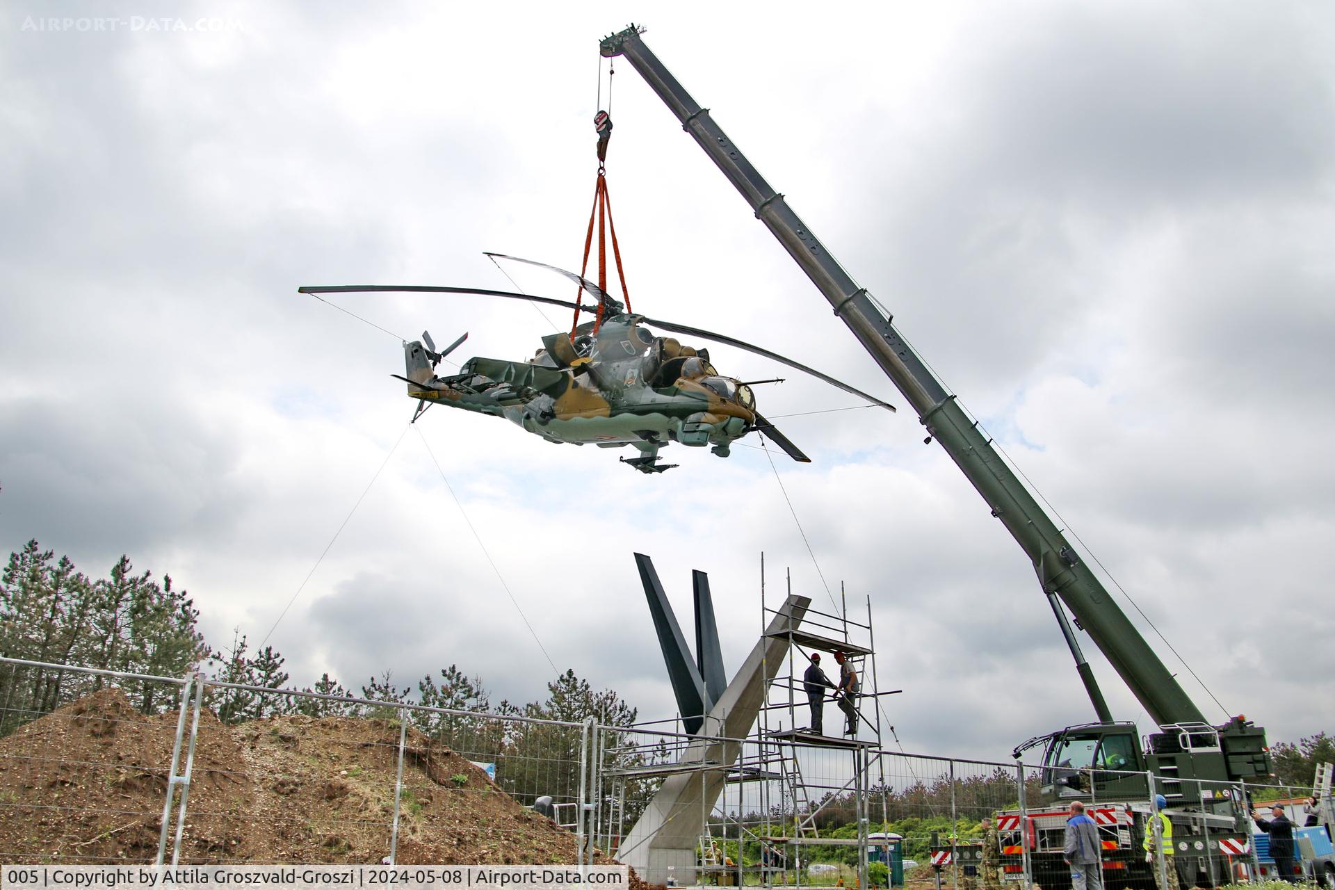 005, 1983 Mil Mi-24D Hind C/N 340275, Displayed as a memorial on the road leading to the former Szentkirályszabadjai Airport. It was given page number 005 in memory of the first Mi-24 combat helicopter to arrive in Hungary. Installation moments.