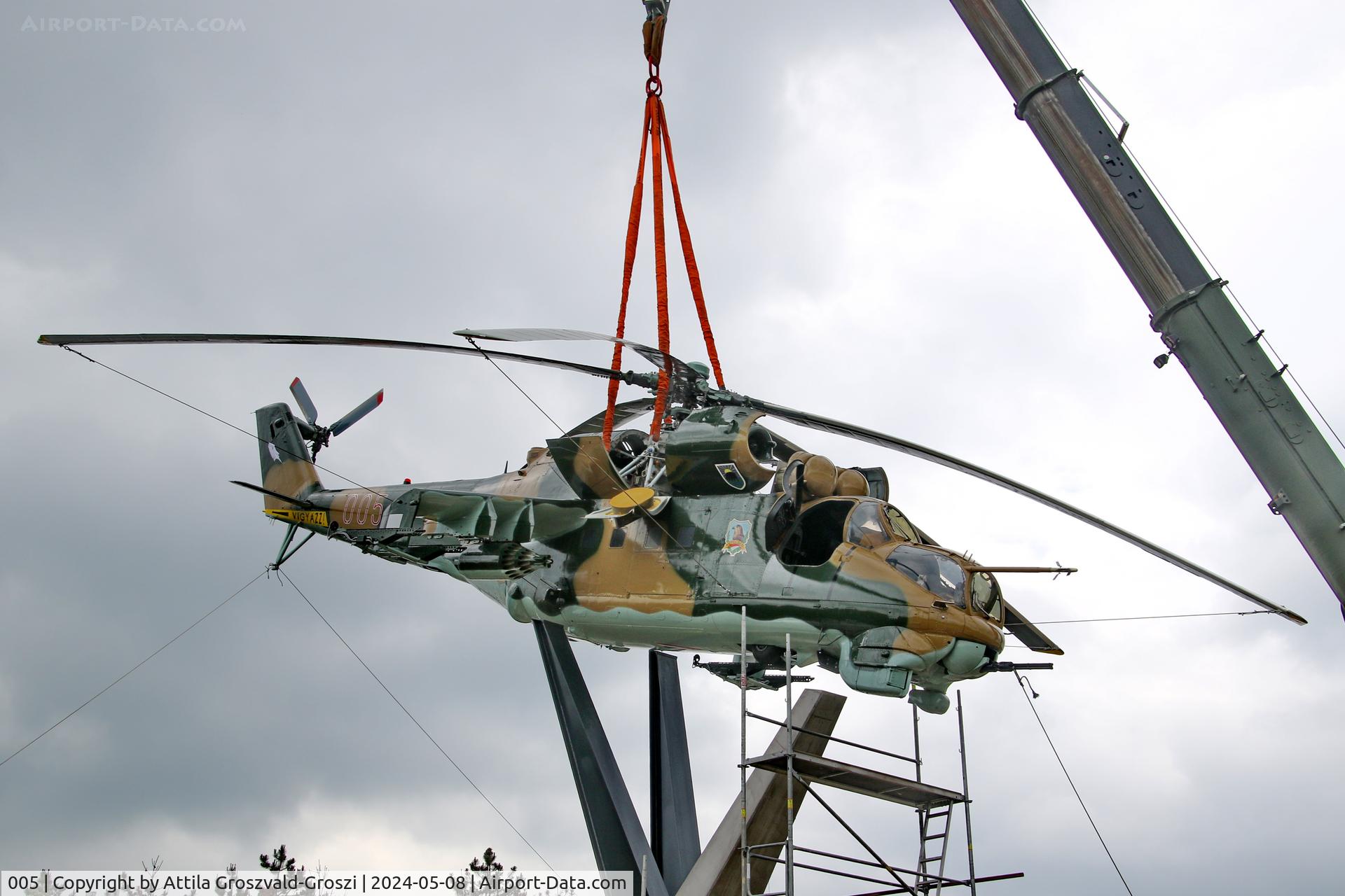 005, 1983 Mil Mi-24D Hind C/N 340275, Displayed as a memorial on the road leading to the former Szentkirályszabadjai Airport. It was given page number 005 in memory of the first Mi-24 combat helicopter to arrive in Hungary. Installation moments.
