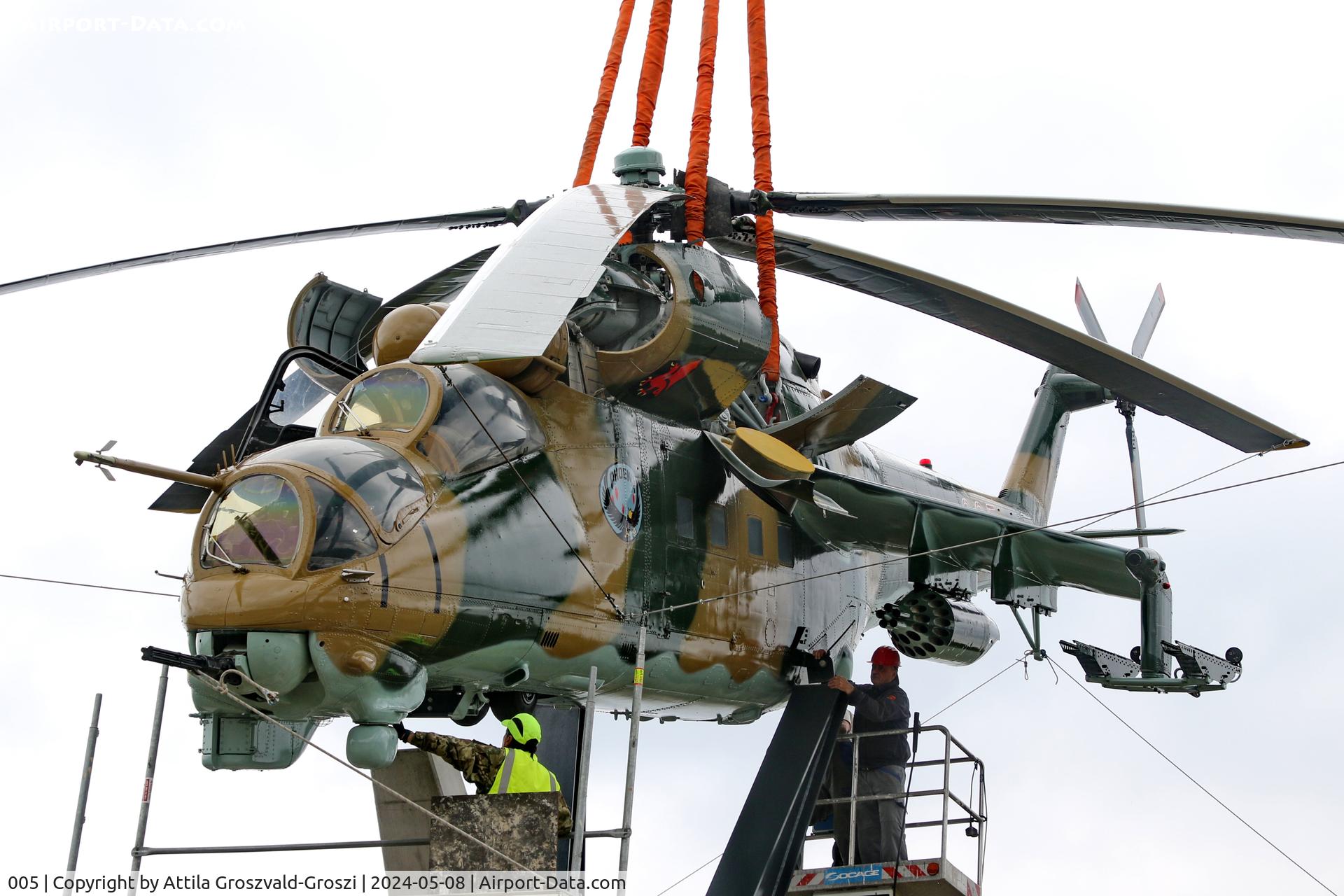 005, 1983 Mil Mi-24D Hind C/N 340275, Displayed as a memorial on the road leading to the former Szentkirályszabadjai Airport. It was given page number 005 in memory of the first Mi-24 combat helicopter to arrive in Hungary. Installation moments.