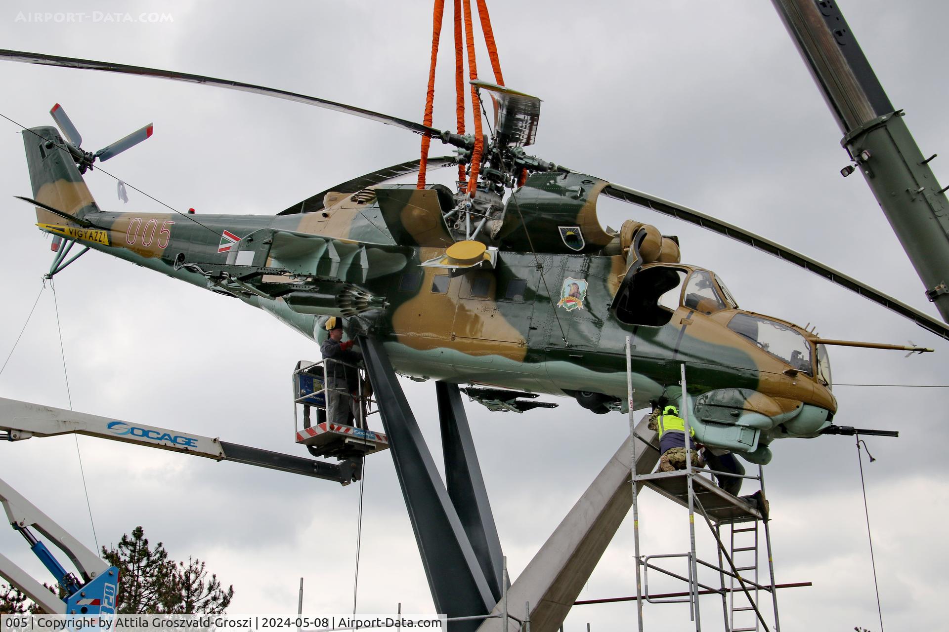 005, 1983 Mil Mi-24D Hind C/N 340275, Displayed as a memorial on the road leading to the former Szentkirályszabadjai Airport. It was given page number 005 in memory of the first Mi-24 combat helicopter to arrive in Hungary. Installation moments.