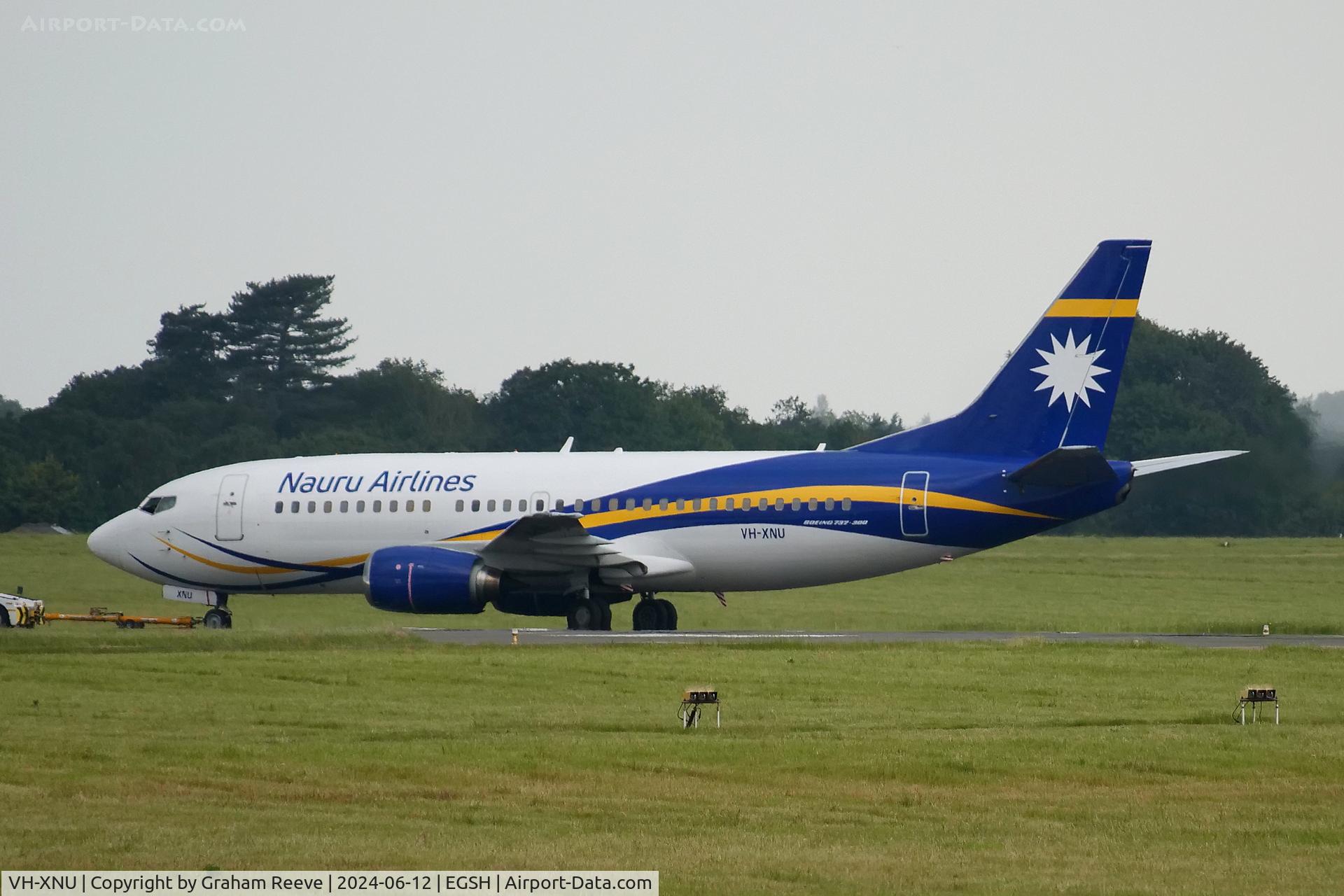 VH-XNU, 1999 Boeing 737-319 C/N 25609, Under tow at Norwich from the engine test area.