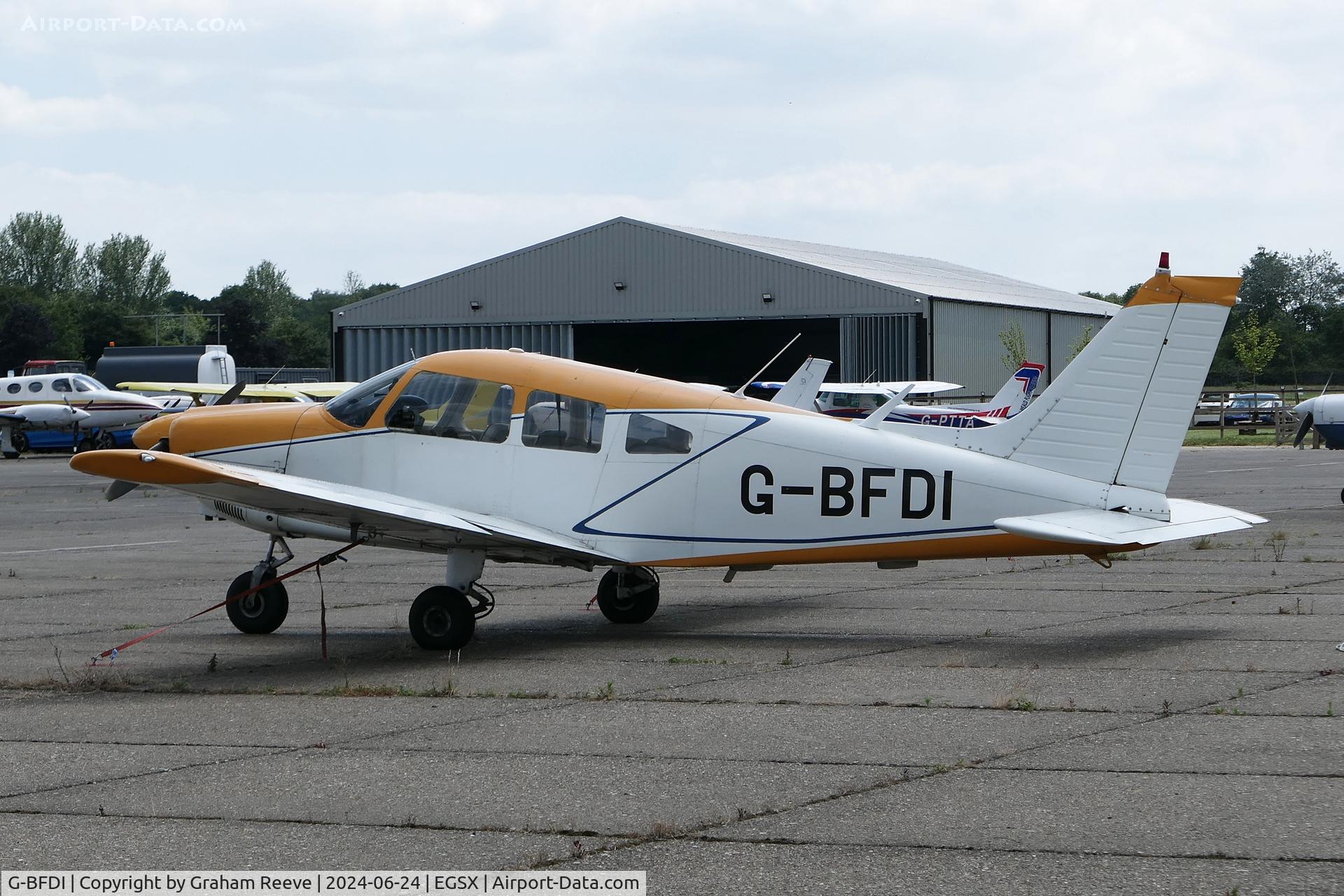 G-BFDI, 1977 Piper PA-28-181 Cherokee Archer II C/N 28-7790382, Parked at North Weald.