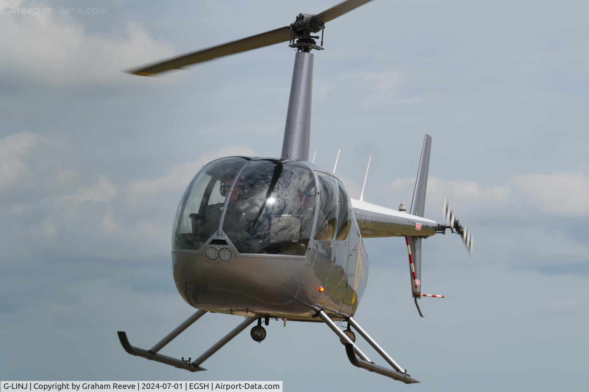 G-LINJ, 2008 Robinson R44 Raven II C/N 12168, Landing at Norwich.