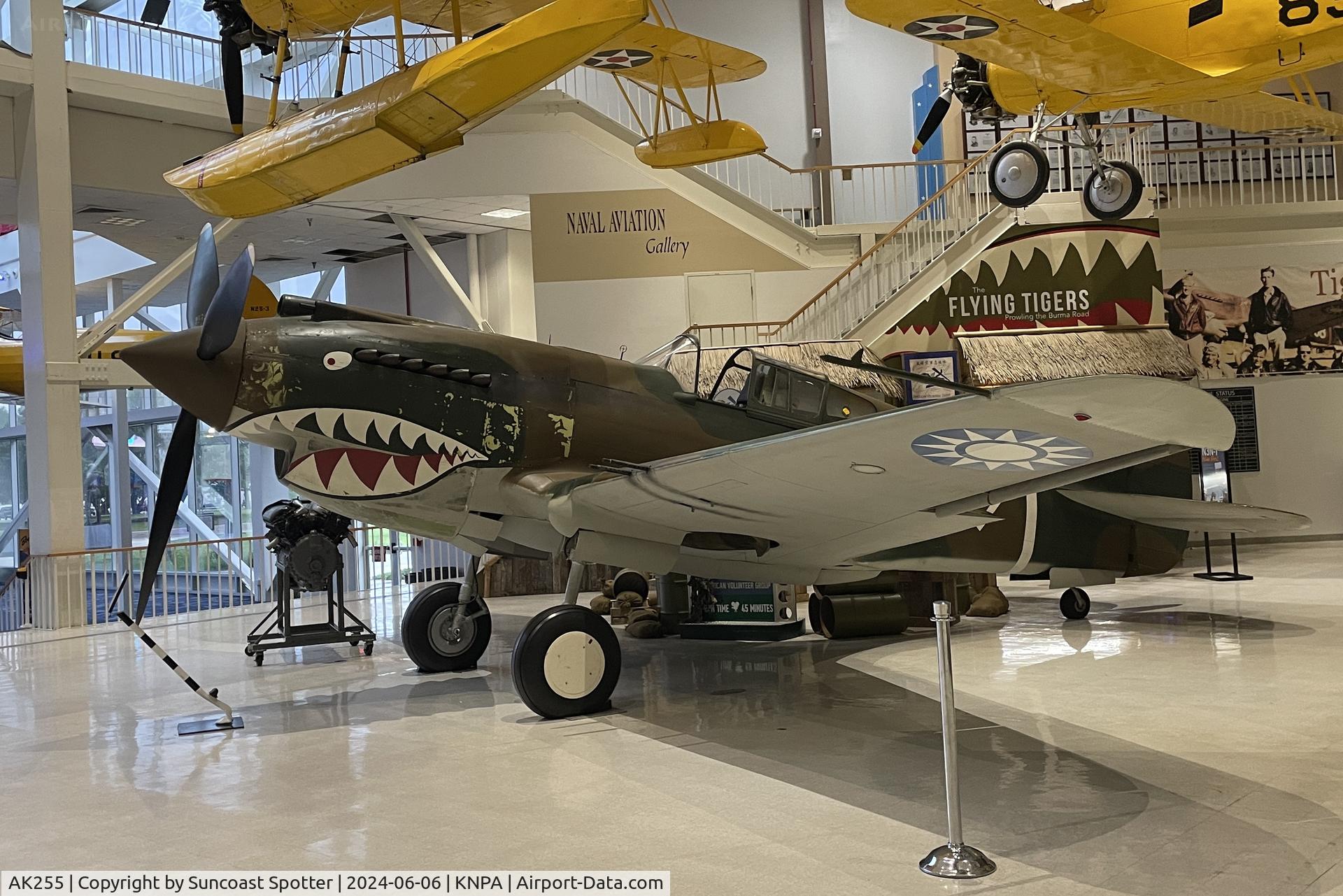 AK255, 1942 Curtiss P-40C Tomahawk Mk.IIb C/N 14737, A P-40 Tomahawk of the First American Volunteer Group Flying Tigers sits on display at the National Naval Aviation Museum