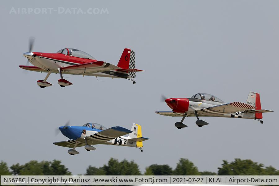 N5678C, Vans RV-8 C/N KC-1, RV airplanes taking off for large formation flight over Oshkosh grounds