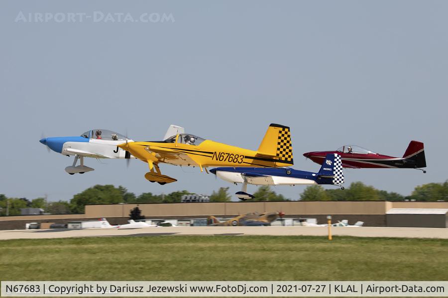 N67683, 2007 Vans RV-7 C/N 72630, RV airplanes taking off for large formation flight over Oshkosh grounds
